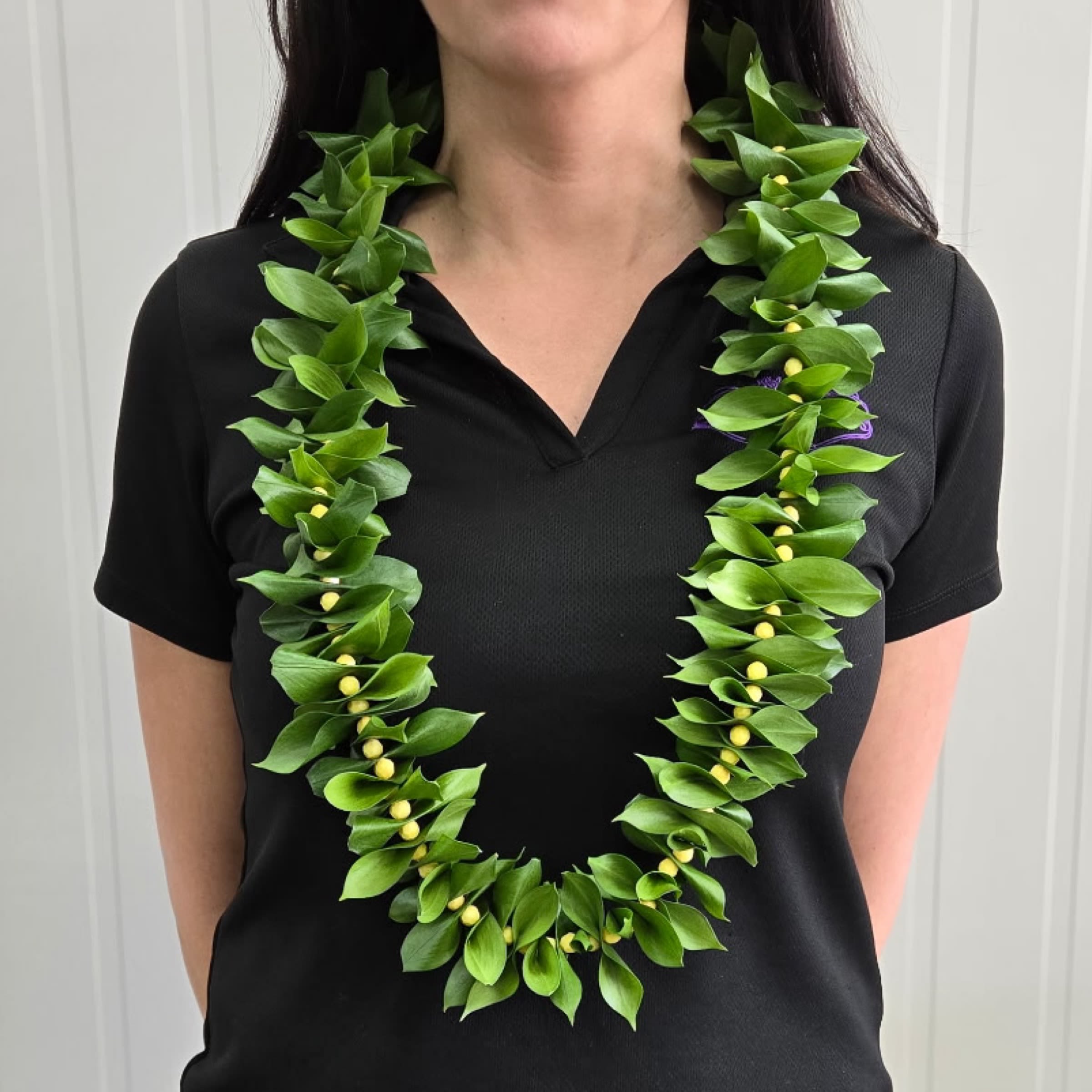 Green Leaf Graduation Lei - This Graduation Lei is made with long lasting Italian Ruscus Leaves.   Write your Bead Color preferences in the Special Instructions at Checkout.  *Options*  White Black Yellow