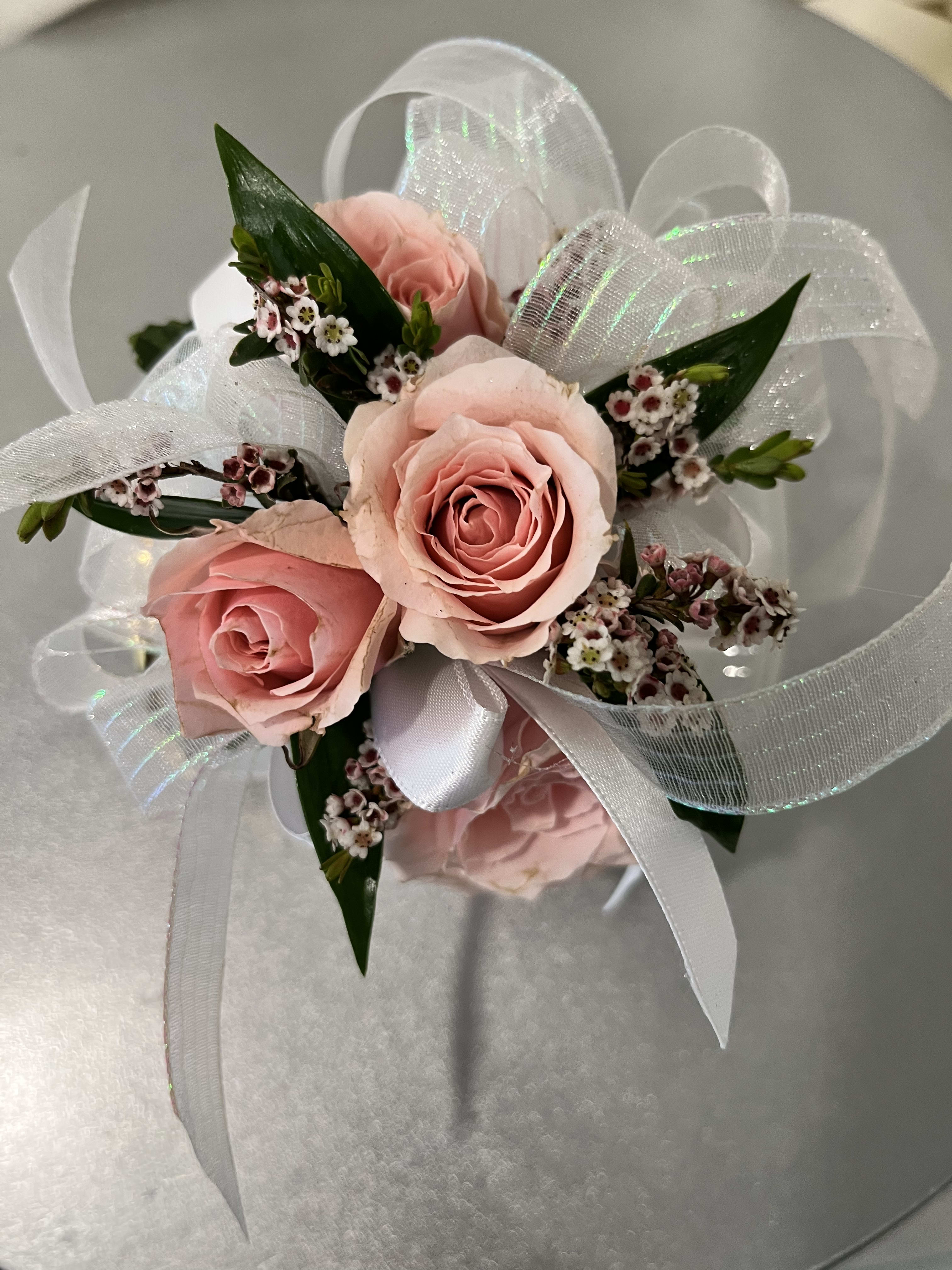 Pink rose bouquet with white ribbon and sheer wrap