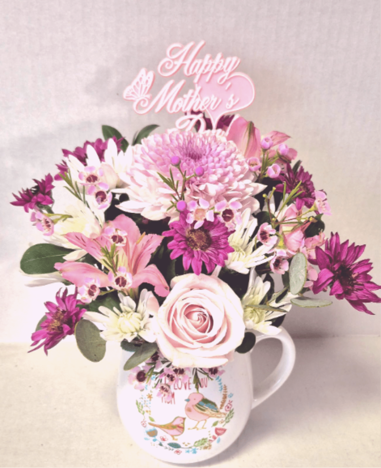 Lovely Mug 4 Mom ..Includes a mylar balloon - A lovely sentiment in a beautiful mug filled with flowers. Add a Mother's Day balloon and your gift is perfect!