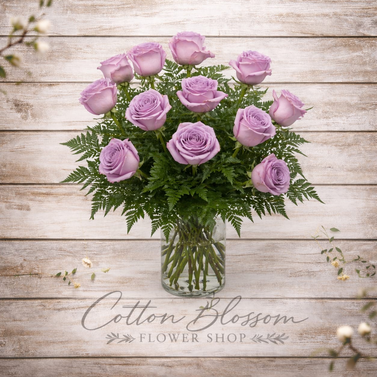 One Dozen Lavender Roses - One Dozen Lavender Roses  Soft, elegant, and truly unforgettable, our one dozen lavender roses are a beautiful expression of enchantment and love at first sight. Each rose is carefully selected for its delicate color and premium quality, then hand-arranged with fresh greenery in a clear glass vase for a timeless, romantic presentation.  Perfect for anniversaries, birthdays, or simply to show someone how much they mean to you, this arrangement offers a graceful and sophisticated twist on a classic favorite.   Vase and greens may vary slightly based on availability while maintaining the overall style and value.699