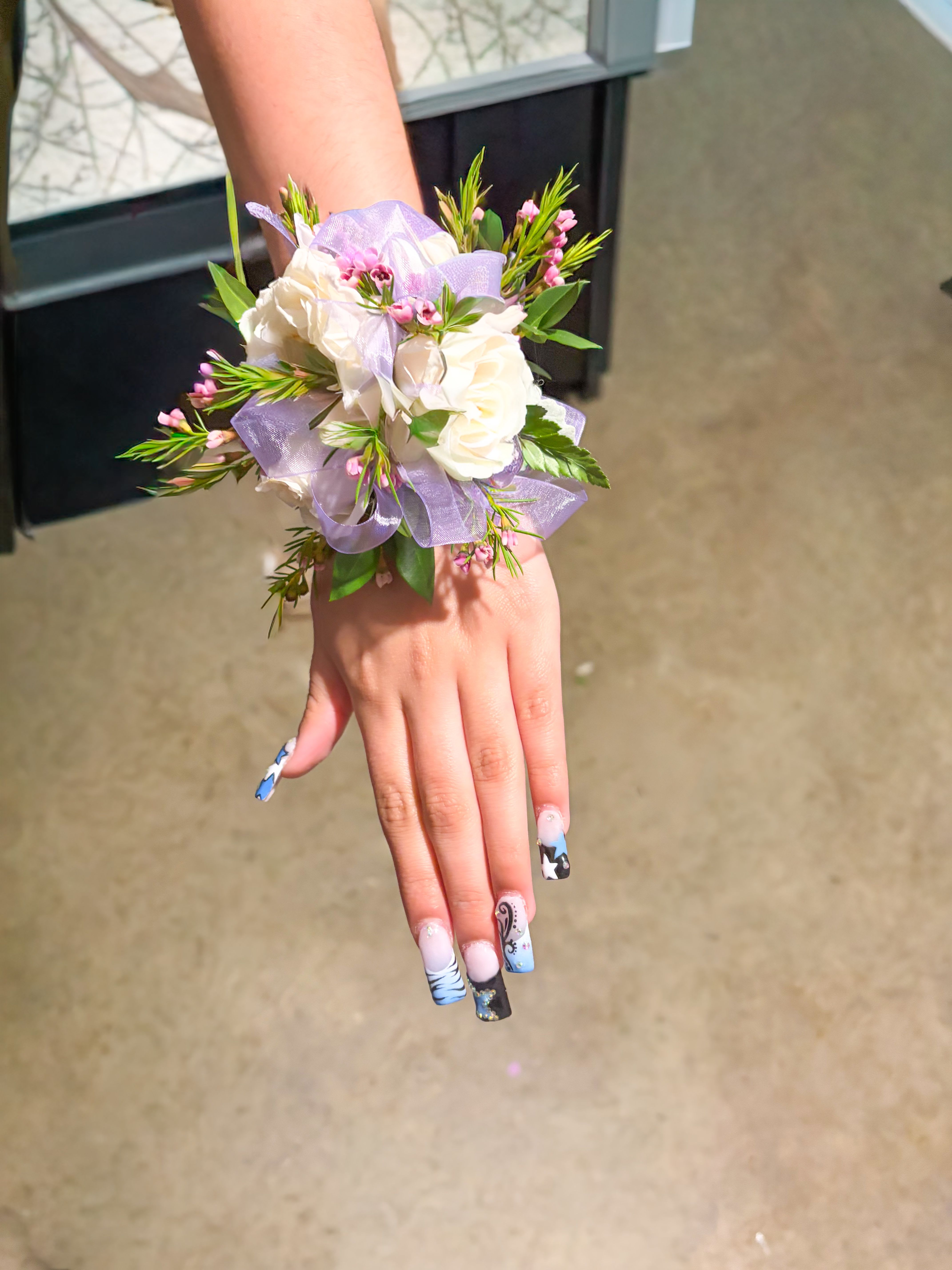  corsage - white spray rosa corsage we purple ribbon