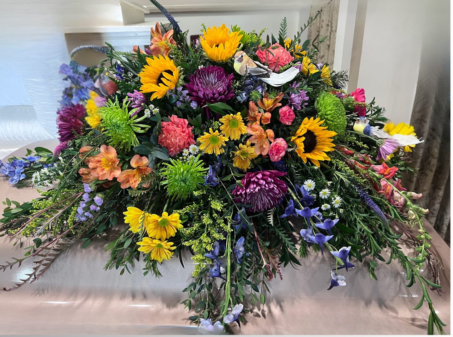Sunset Meadow Casket Spray - This colorful casket spray includes a variety of wildflowers