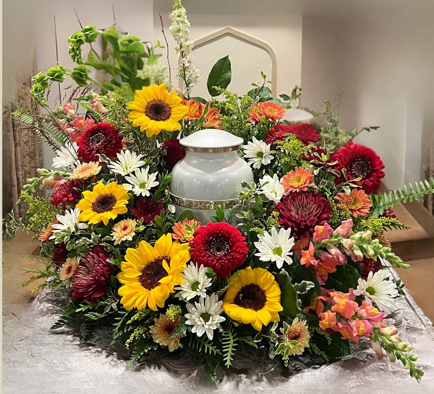 Warm Memories Wreath - The price for this wreath will vary depending on the flowers chosen and the size of the ring needed. Price ranges from $225-425.