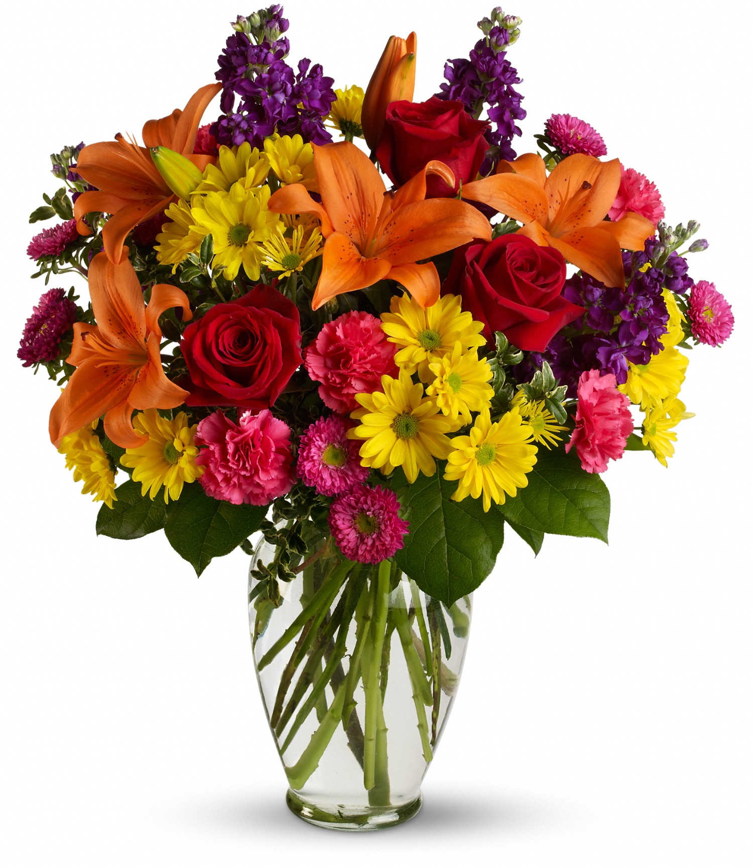 Mixed bouquet of orange lilies, red roses, and yellow daisies in a glass vase