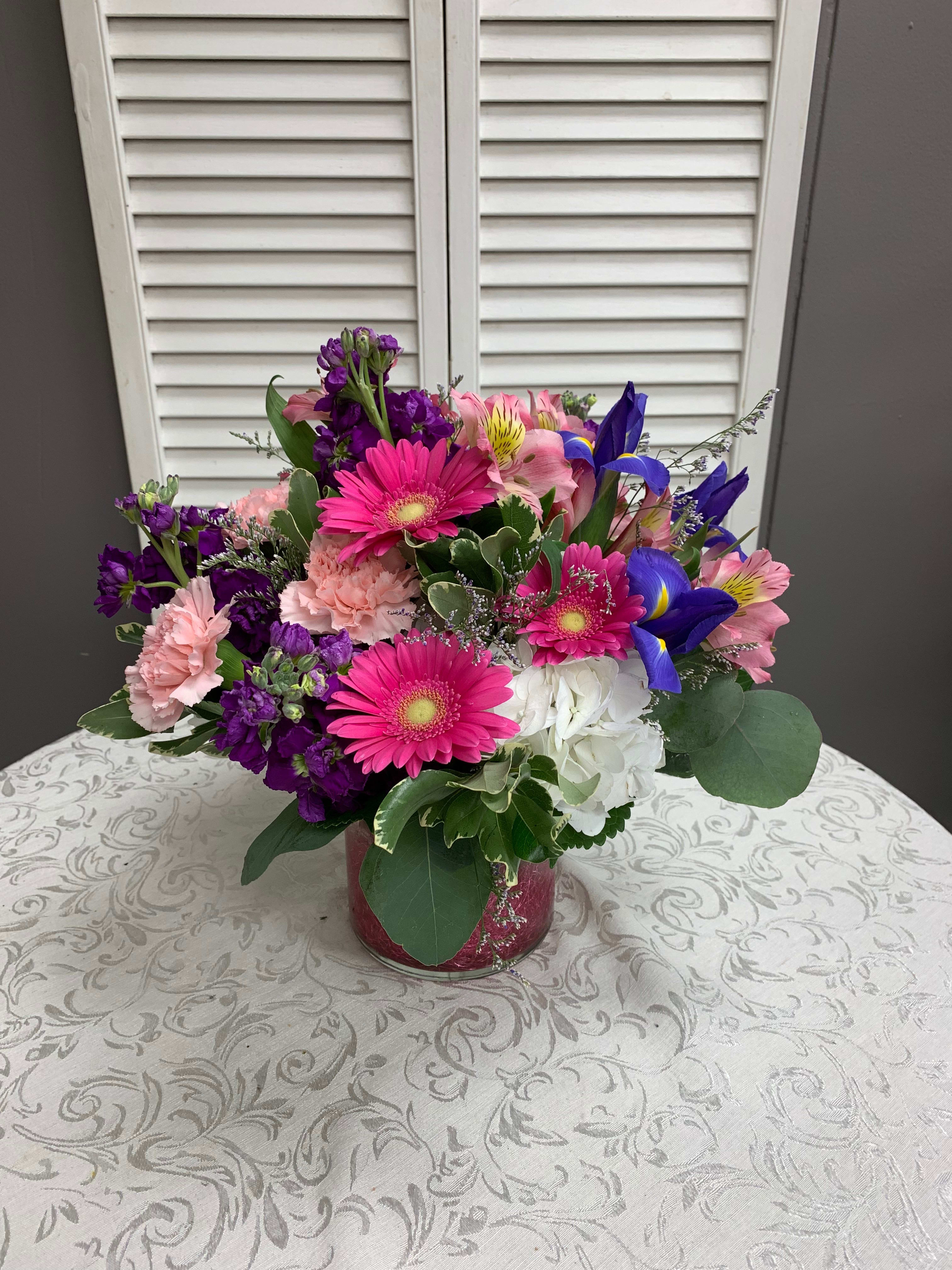 Full of Joy Arrangement - Arrangement includes Hydrangea, Stock, Gerbera Daisies, Carnations, Iris and Caspia. Flowers may vary.