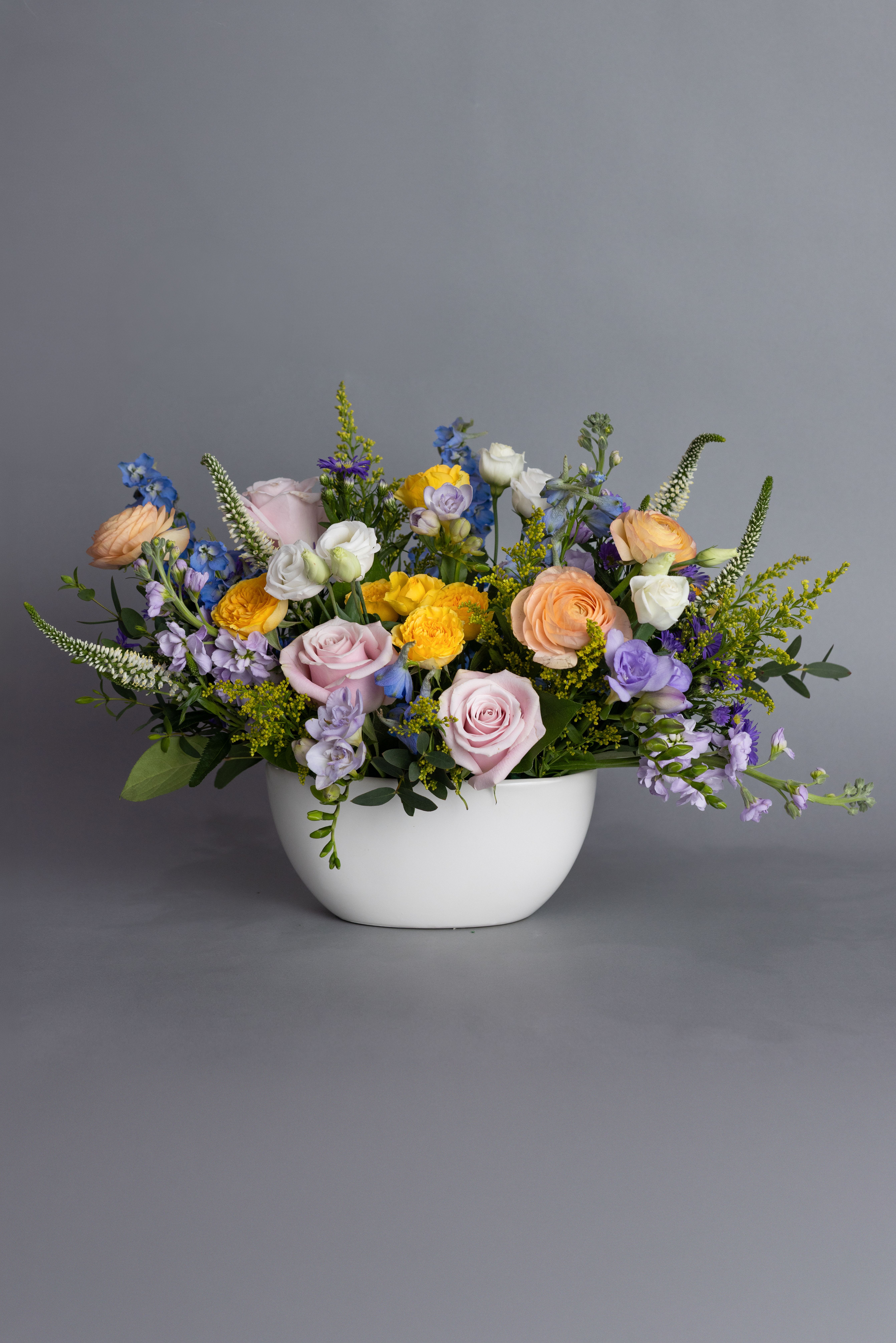 Sunday Brunch - Our expert and passionate designers will create a one-of-a-kind arrangement with all the freshest blooms spring has to offer. We welcome your input, so please add your preferred colors in the special instructions as well as who it is for and where the flowers might live (dining table, kitchen island, coffee table, entrance table, etc.) We can't wait to design for you!   Arrangements will range from 12" long to 16" long and be 11" (for a table) or 15" tall. 