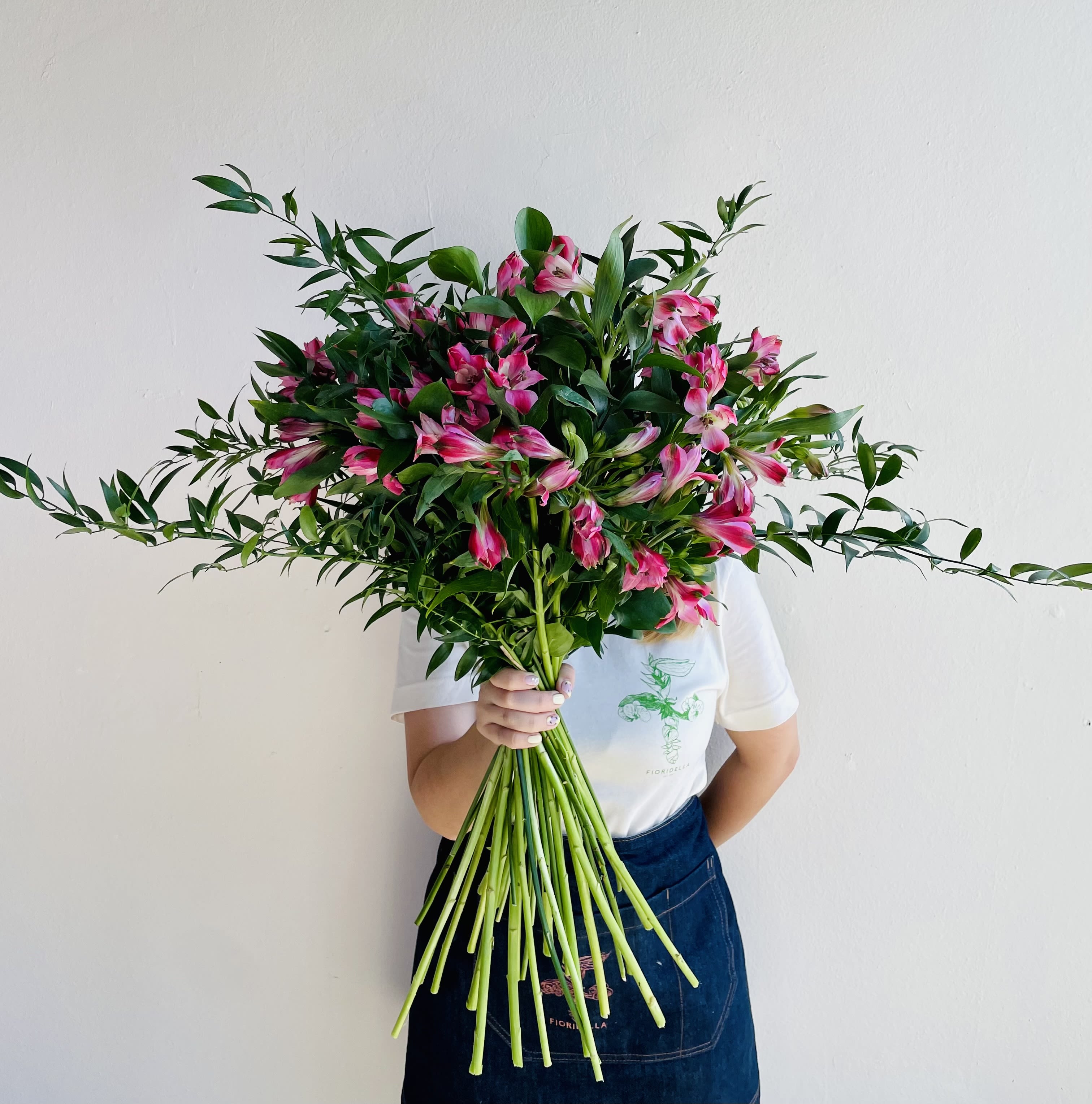 Large bouquet of pink alstroemeria with long green stems