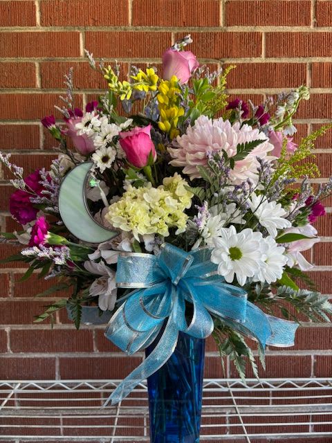 Love You to the Moon &amp; Back - An elegant bouquet of fresh flowers partnered with a lovely stained glass crescent moon made by a local artist that your loved one can keep to remind them you love them to the moon &amp; back.