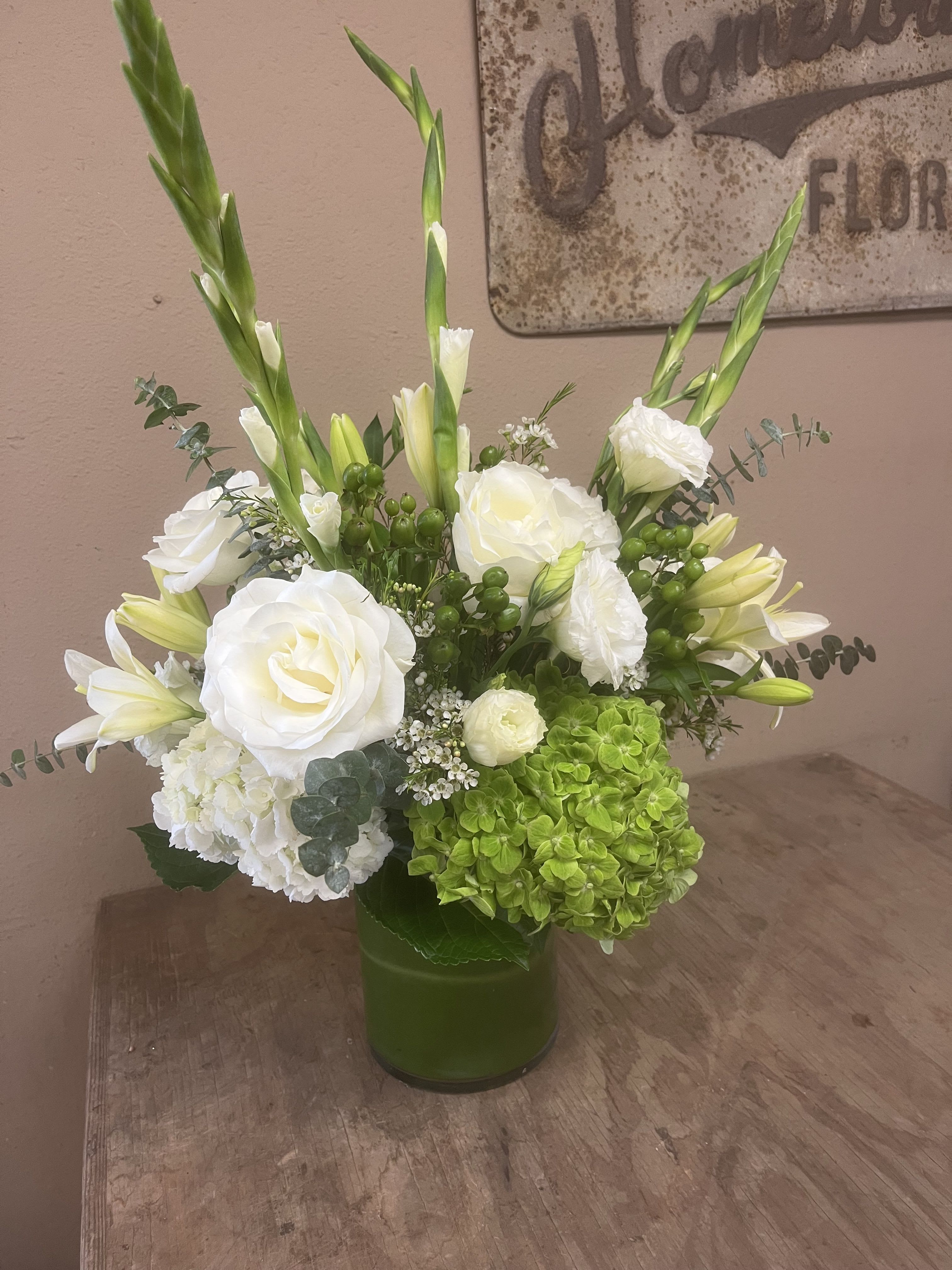 FRESH - Greens and whites gives this arrangement a crisp, clean look appropriate for any occasion.