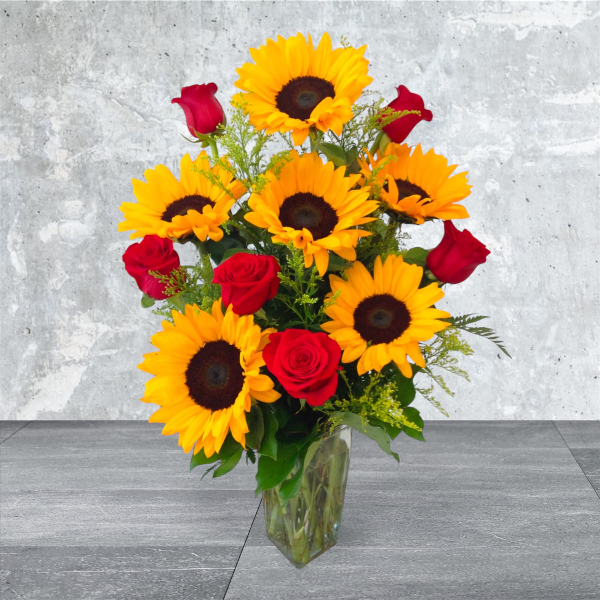 Sun Rose  - Bright sunny Sunflowers paired with beautiful RED roses (or color of your choice, let us know in special instructions if you prefer another color rose). Then beautifully arranged by our artisan florist with lush greens and accents in a glass vase.