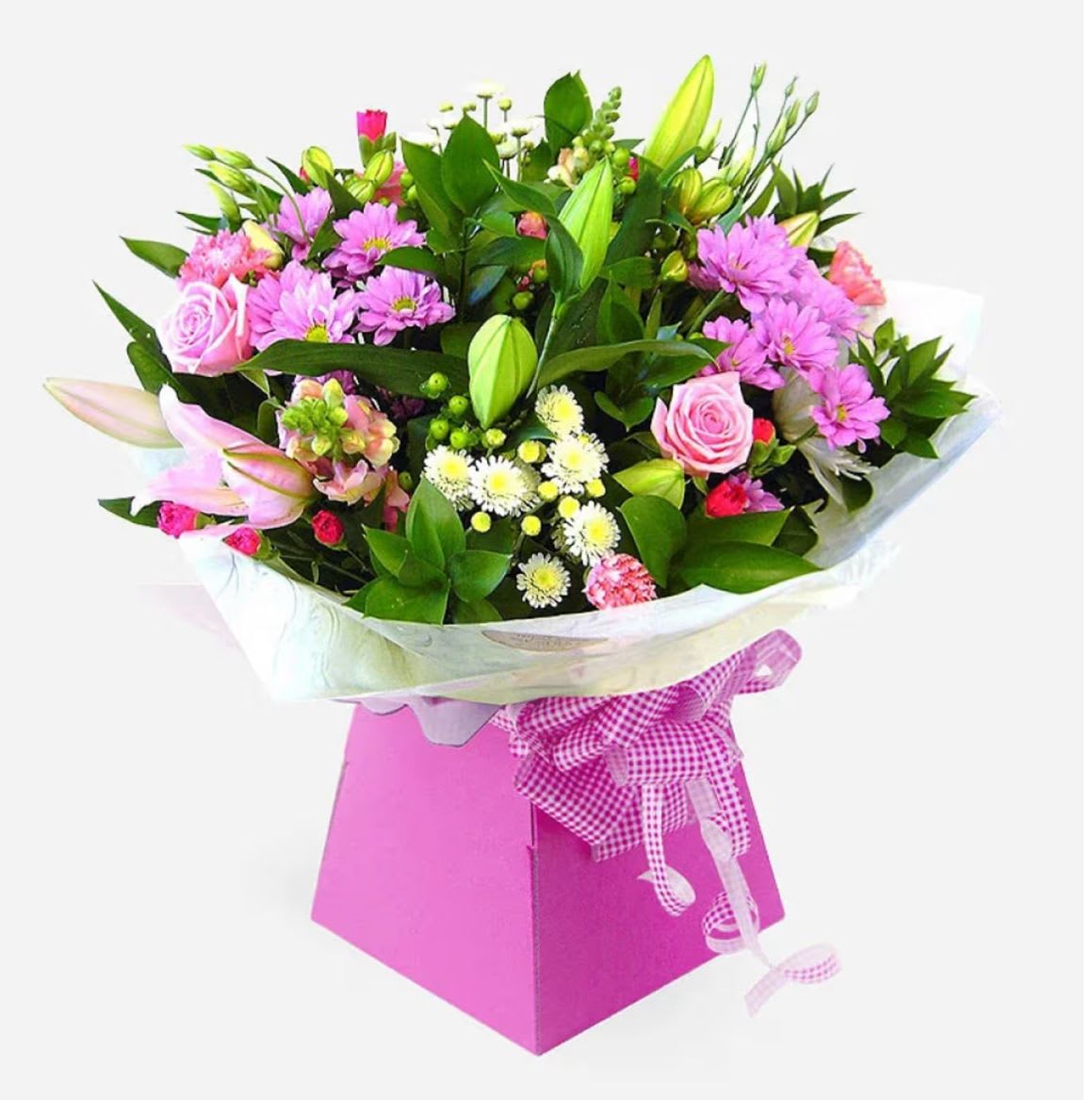 Ashleigh - Brighten someone’s day with this stunning hand-tied bouquet presented in a pink gift box. This delightful arrangement features a lovely mix of seasonal blooms in soft and vibrant shades of pink, white, and green.  Flowers Included: • Pink Roses • Lilies (Pink and unopened buds) • Pink Chrysanthemums • White Spray Chrysanthemums • Carnations (pink) • Seasonal greenery and filler flowers  Perfect for birthdays, anniversaries, or simply to show someone you care.