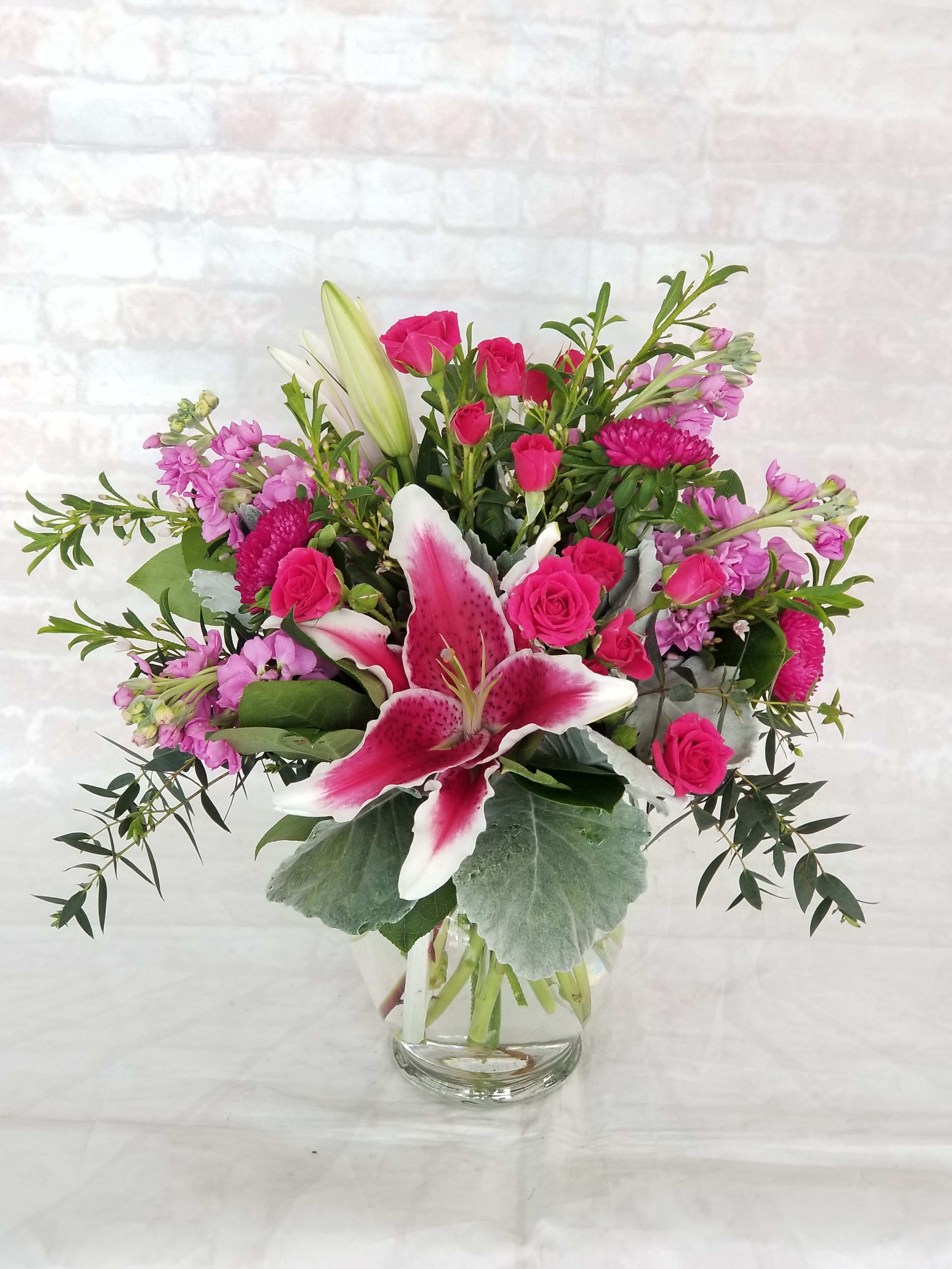 Think Pink  - Select this bright and stunning arrangement of Oriental Lilies, Stock, and Asters. 
