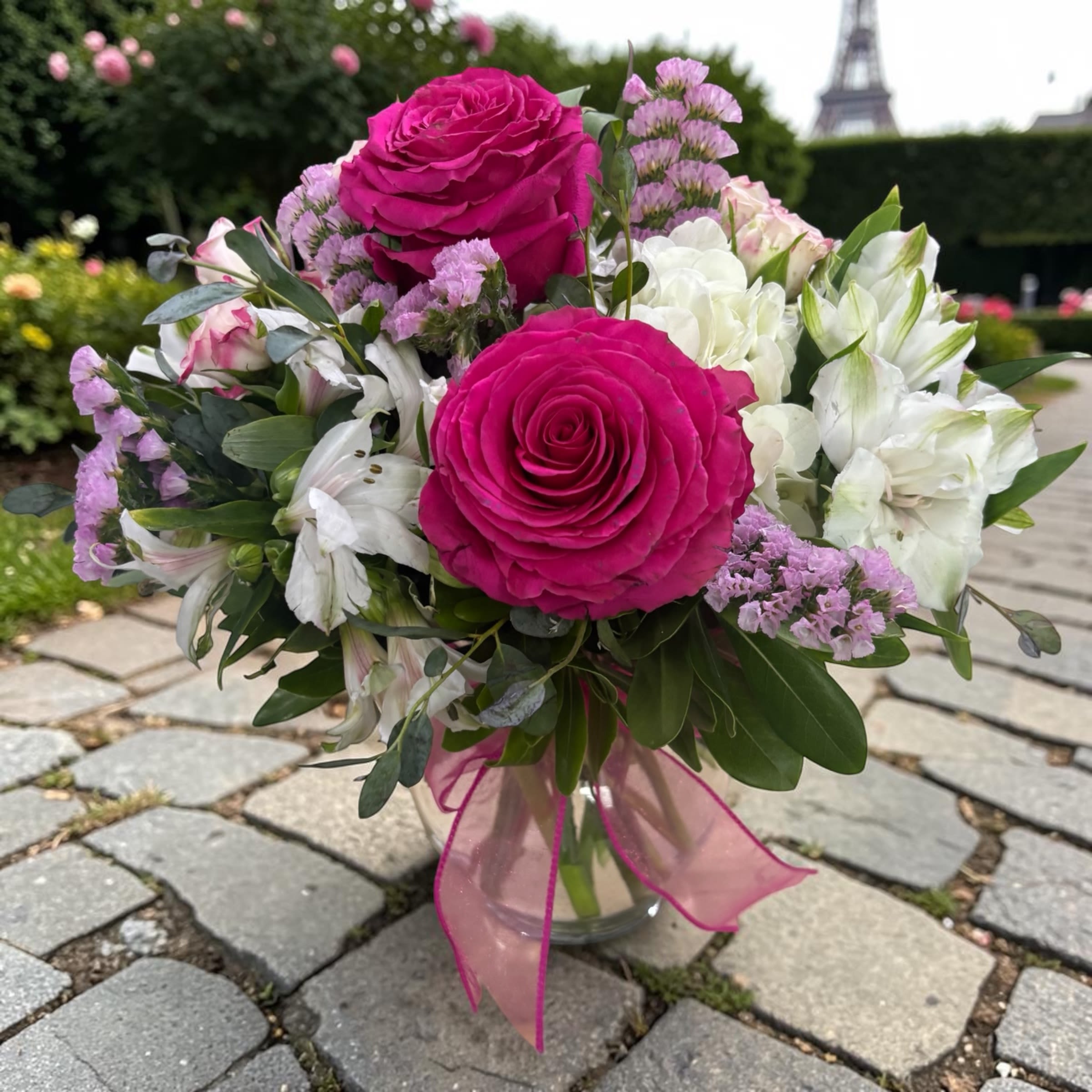 Kensington Garden - Kensington Gardens Standard is a romantic fresh flower arrangement inspired by elegant English garden style and designed in a clear glass bubble bowl. Featuring hot pink roses, white hydrangea, spray roses, alstroemeria, lavender statice, and fresh greenery, this bouquet offers a soft, airy look filled with color and texture.  Bright pink, crisp white, and lavender tones make this arrangement a beautiful choice for Mother’s Day, birthdays, anniversaries, thank you gifts, get well wishes, or simply brightening someone’s day. Its compact rounded shape is perfect for tables, desks, counters, and bedside spaces.  Handcrafted by Aspen Tower Florist in Greensburg, Indiana, Kensington Gardens Standard is a thoughtful gift for customers searching for pink rose bouquets, hydrangea arrangements, elegant flower gifts, Mother’s Day flowers, birthday flowers, and local flower delivery in Greensburg, Batesville, Rushville, Shelbyville, Westport, Hope, and surrounding communities.  Flower varieties may vary based on freshness and availability while maintaining the same style, color palette, and value. Order early for best selection during holidays and peak delivery dates.