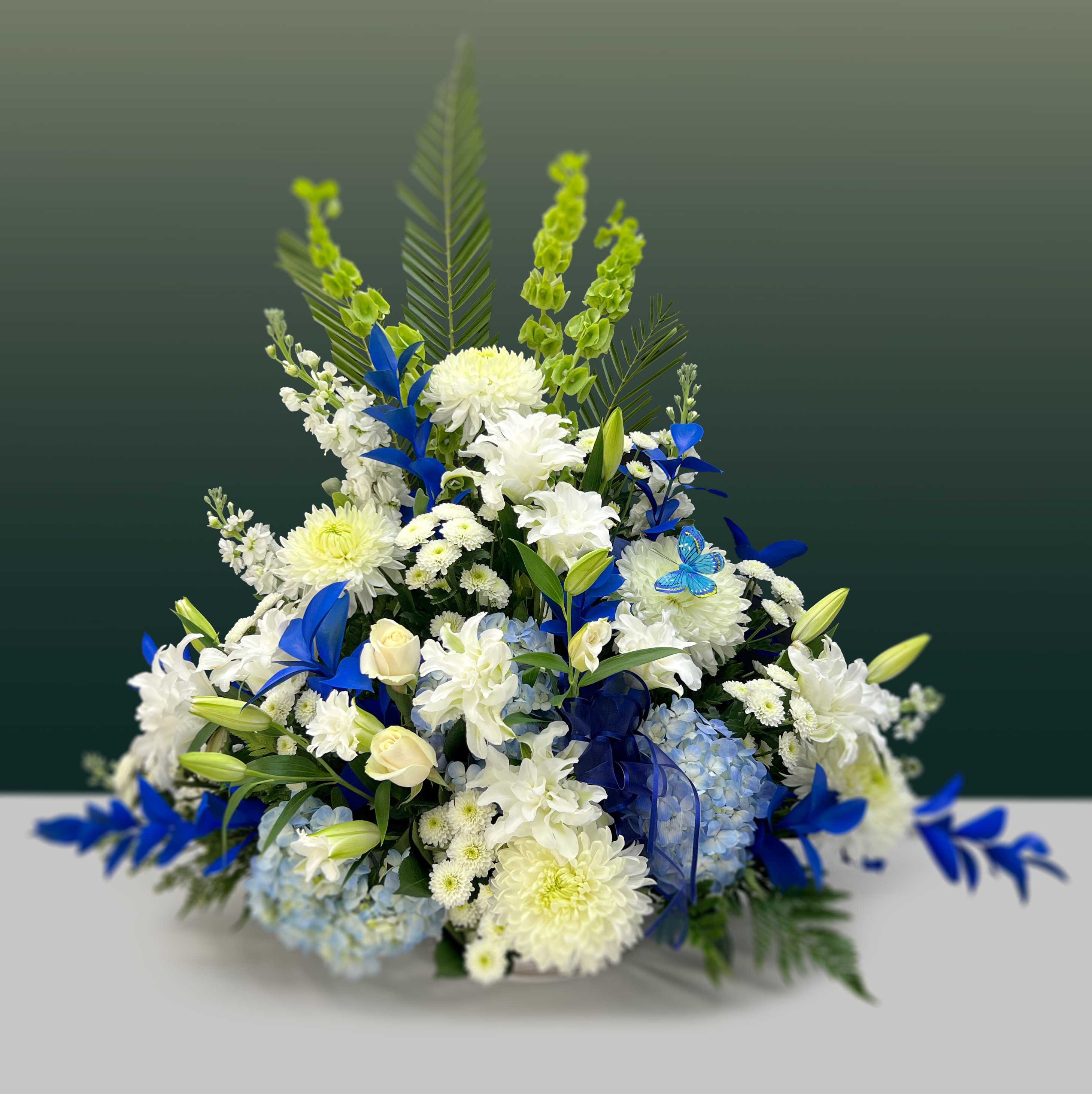 Heartfelt Sympathy Blue - Simply stated sending your love with the heartfelt sympathy basket with a gentle palette of blues and whites. 