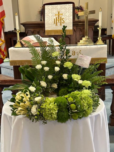 Funeral Wreath in Green - Wreath for a funeral urn with a variety of green and white flowers