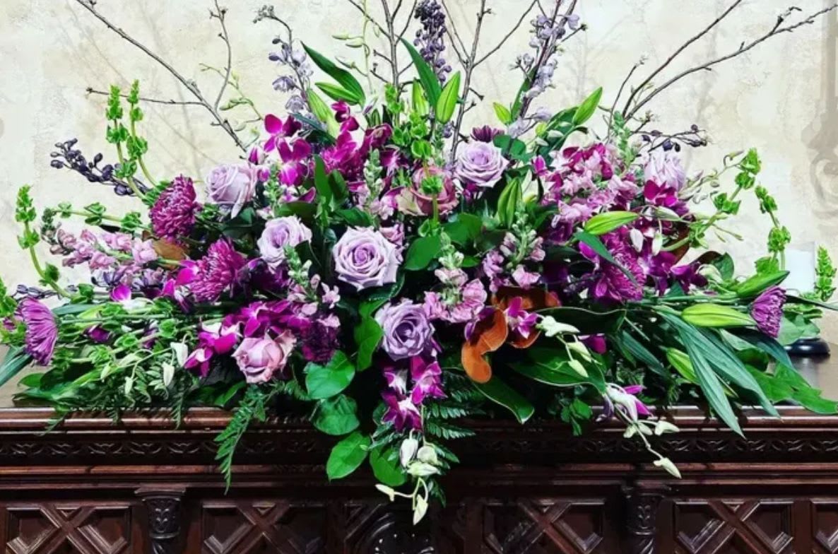 At Rest Casket Spray - This tribute is a heartfelt expression of sympathy, perfect for celebrating your beloved's life remembered with tenderness, calm and enduring love. 