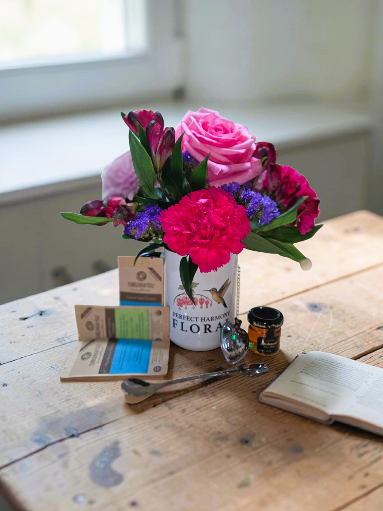 Flowers and Tea  - Delight in the charm of the simpleness of flowers (choose your preferred flower color) in a mug. Enjoy your flowers and later sit and enjoy a cup of soothing local tea. Farmed by our very own Tumblewood Teas, out of Big Timber, Montana. Also included is a tulip stir spoon, heart shaped tea infuser, and honey. Tea pot is not included. 