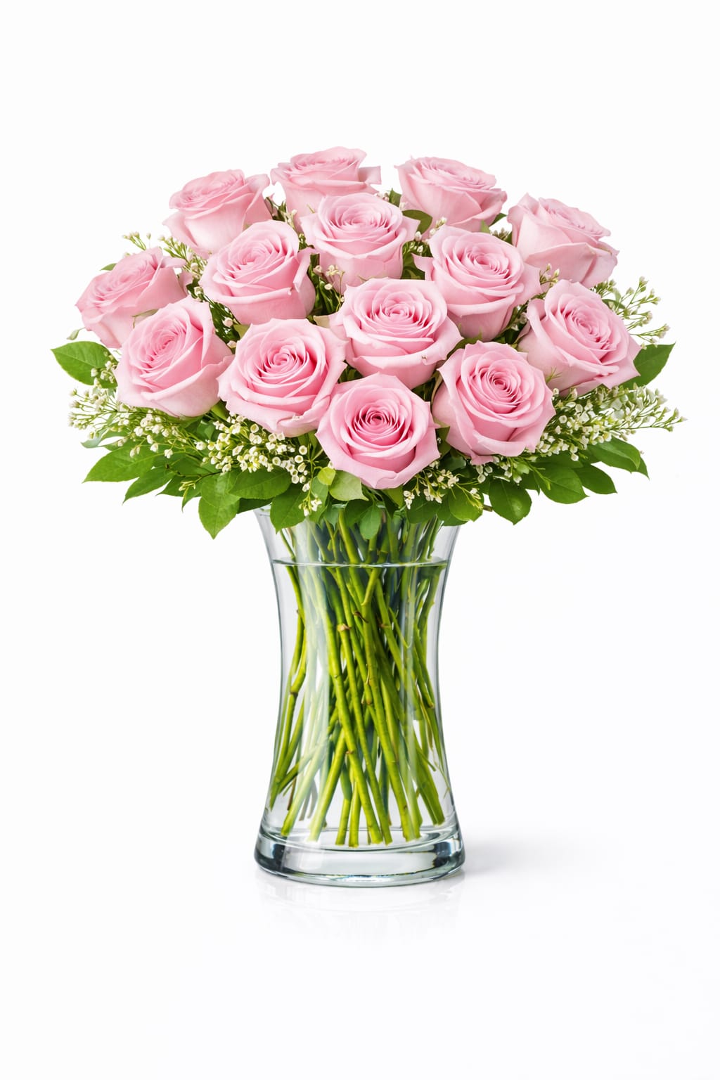 Pink roses arranged in a clear glass vase