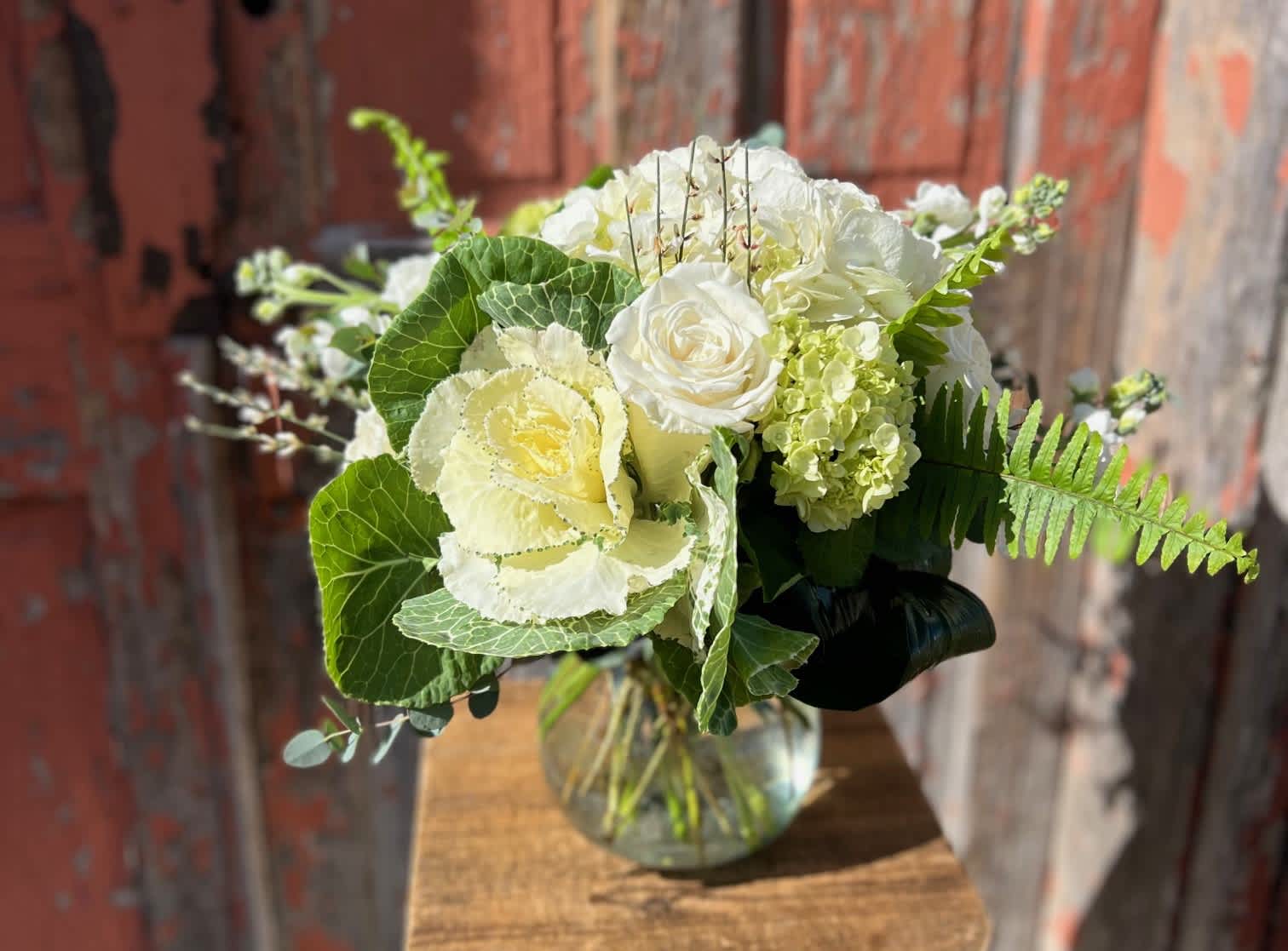 White floral bouquet in a clear glass vase