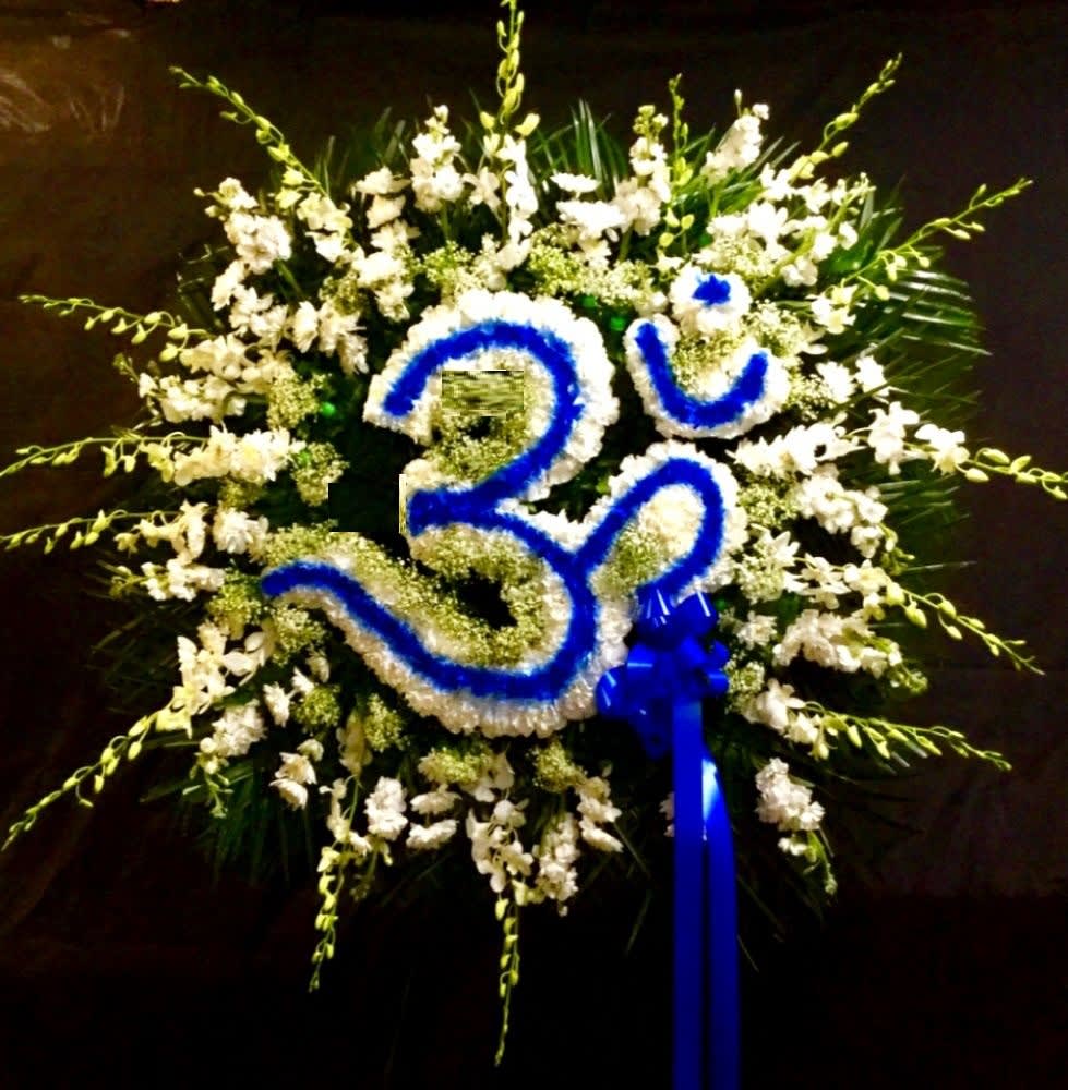 White floral wreath with a blue number 30 and ribbon