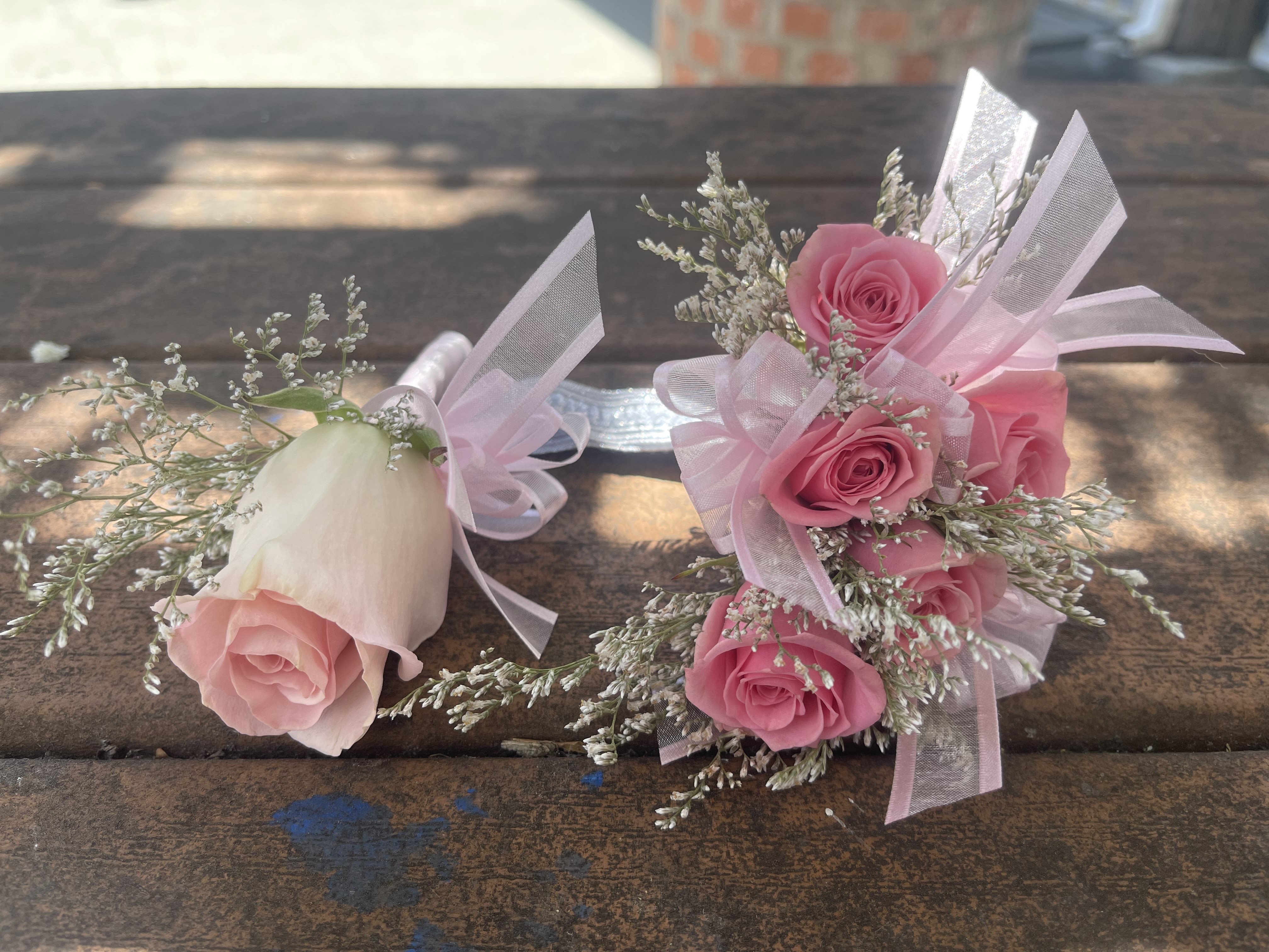 Pink rose boutonniere and matching rose wrist corsage with ribbon