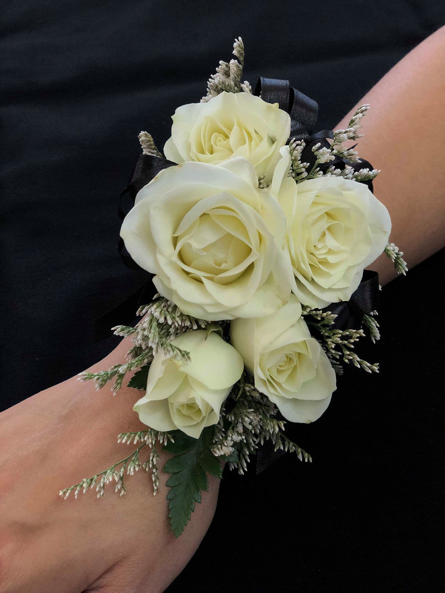 White rose wrist corsage with black ribbon