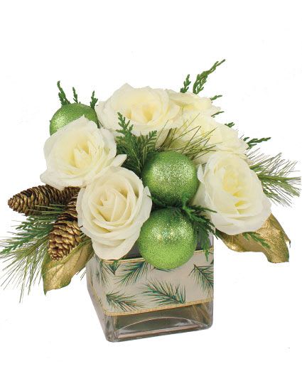 Wintergreen Roses Arrangement - White roses, evergreens, festive pinecones and glittery green balls form a wintry wonderland that is just the thing to lift holiday spirits. Order this elegant bouquet of Christmas flowers today!  Includes: Cube Vase, Foliage: Salal (Painted Gold), Seasonal Evergreens (Cedar, Pine), White Roses, Pine Cones (Painted Gold), Glitter Green Mm Balls, Winter Pine And Gold Ribbon.