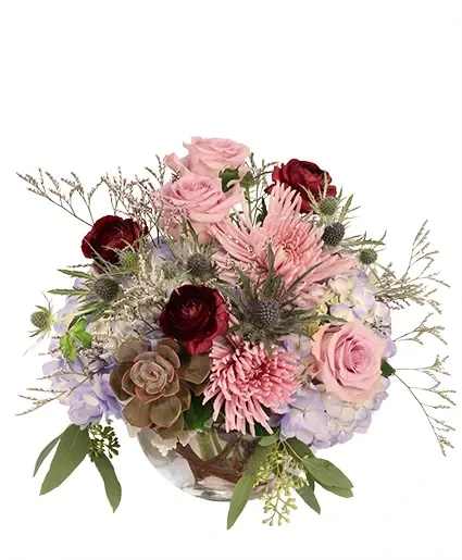 Softly at Twilight Flower Arrangement - What a dream! The gorgeous burgundy ranunculus contrasts beautifully against the blue and purple shades of the roses, hydrangeas, spider mums, and more, making Softly at Twilight a striking mix. Send this stunning arrangement to someone you love today!  Includes: Bubble Bowl, Dusty Miller, Seeded Eucalyptus, Misty Blue, Curly Wood In Vase, Succulent , Blue Thistle , Blue Hydrangea , Burgundy Ranunculus , Lavender Roses, Lavender Spider Mum.