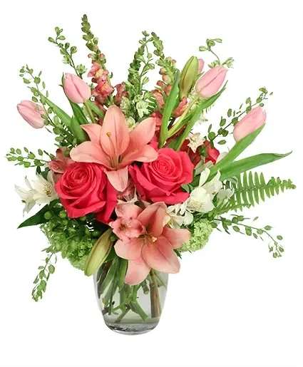 Array of Pinks Floral Arrangement - Talk about a pink lover’s dream! Bursting with gorgeous lilies, roses, tulips, hydrangeas, and more, all in varying shades of pink, Array of Pinks is sure to steal the spotlight in any room. Add a pop of pink to any room or occasion with this pretty bouquet!  Includes: Rose Vase , Pennycress, Sword Fern , Pinkwhite Alstroemeria , White Alstroemeria, Green Hydrangea , White Larkspur , Pink Lily , Hot Pink Roses, Pink Snapdragon, Pink Tulips .