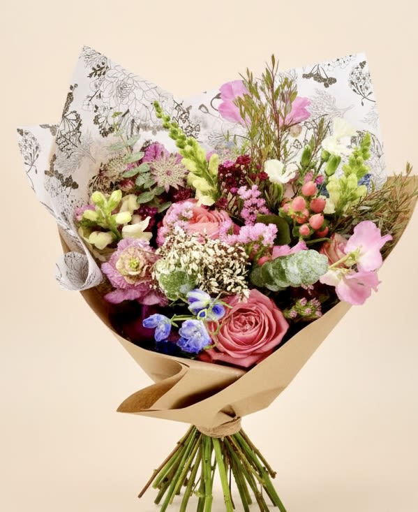 Gratitude Bouquet (Designer’s Choice-pastel mix) - Garden-style bouquet is the perfect way to make your mom or the special woman figure in your life feel special. This bouquet is designer’s choice (we pick the freshest blooms that the market has) Hand-tied Bouquet of pastel colors and seasonal flowers. Wrapped in our signature wrap.  Every effort will be made to recreate your chosen design. Please note that from time to time due to product availability and quality we may need to make substitutions. We will make sure to keep the original design in mind when making substitutions.