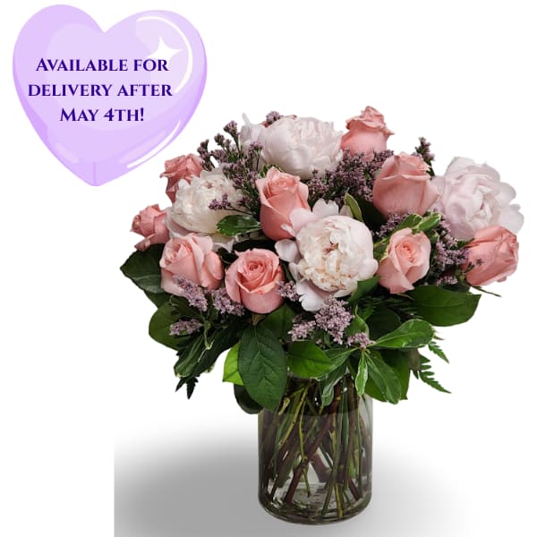 Pastel Gem  - Select this blush arrangement of peonies and roses accented with greens and filler in a clear vase. 