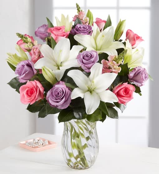 Lavish Bouquet - Mom deserves the absolute best. Let the artistry of nature fill her day with beauty: a luxurious Mother’s Day bouquet in shades of pink, hot pink, and lavender will make sure she gets the message—that Mom deserves to be lavished with love!