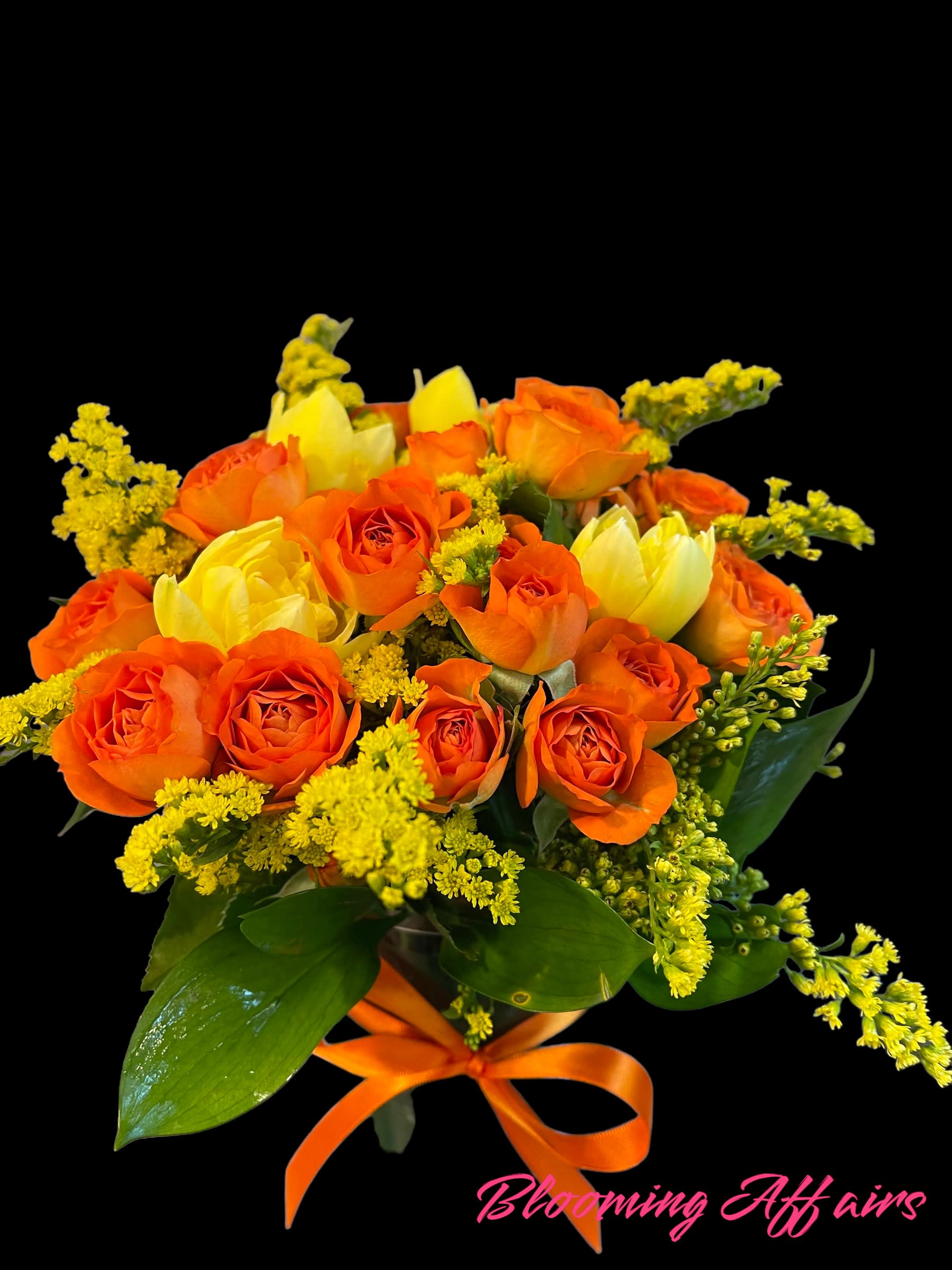 Orange and yellow rose bouquet tied with an orange ribbon