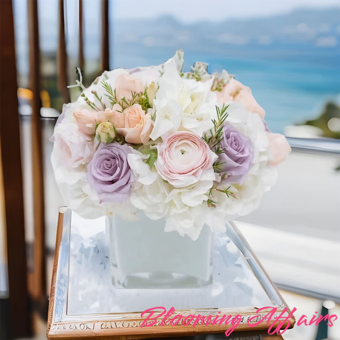 Pastel rose bouquet in a square glass vase
