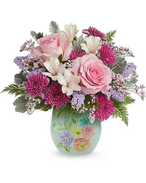Dream in Bloom Bouquet - Make Mom smile with the Dream in Bloom Bouquet, a lovely blend of pink and lavender blooms beautifully arranged in the Watercolor Garden Vase. This heartfelt Mother's Day surprise brings soft spring color and a keepsake she'll enjoy. The Dream in Bloom Bouquet is a beautiful Mother's Day floral arrangement featuring pink roses, ivory alstroemeria, purple cushion spray chrysanthemums, lavender sinuata statice, and pink limonium, accented with dusty miller and leatherleaf fern, delivered in the Watercolor Garden Vase