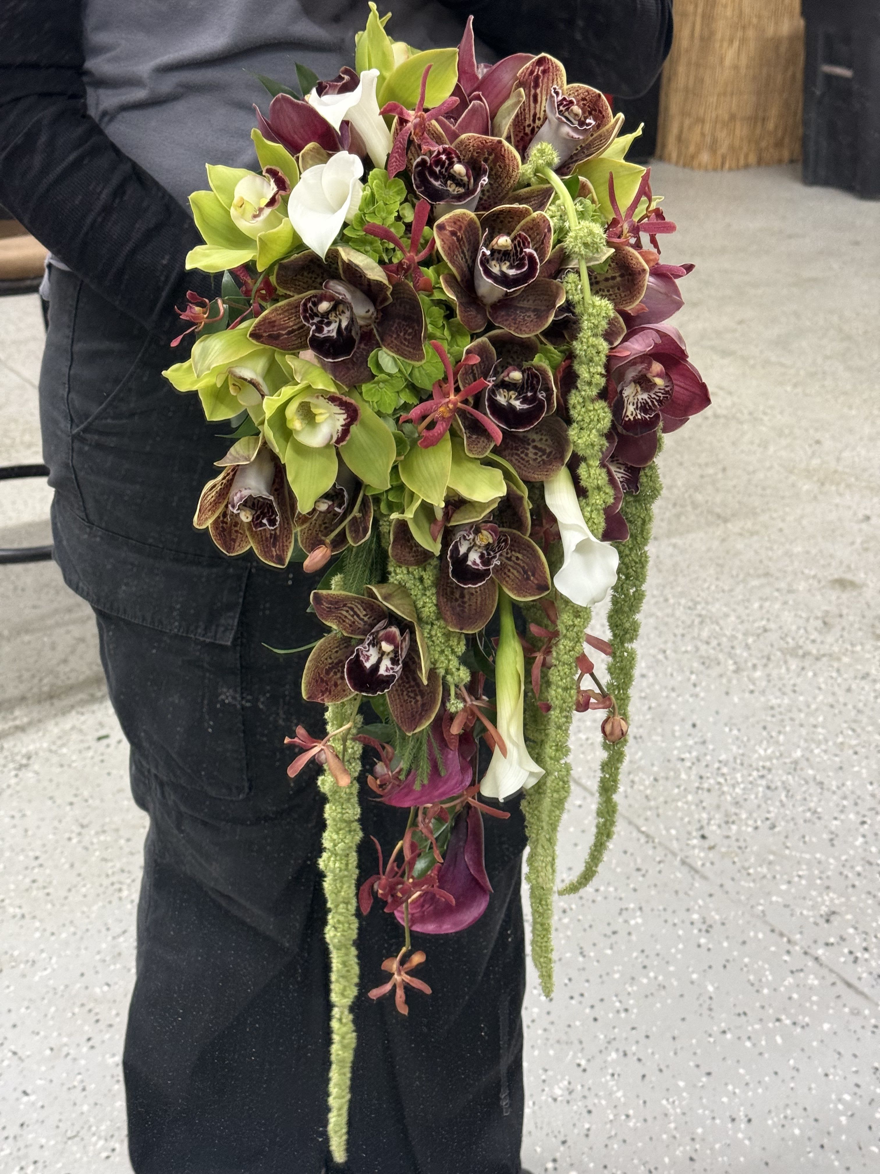 Bridal Cascading Bouquet - Eternal Serenity   - A unique blend of orchids, amaranthus, roses, and mini callas. Modern elegance meets natural charm for a timeless bridal look.