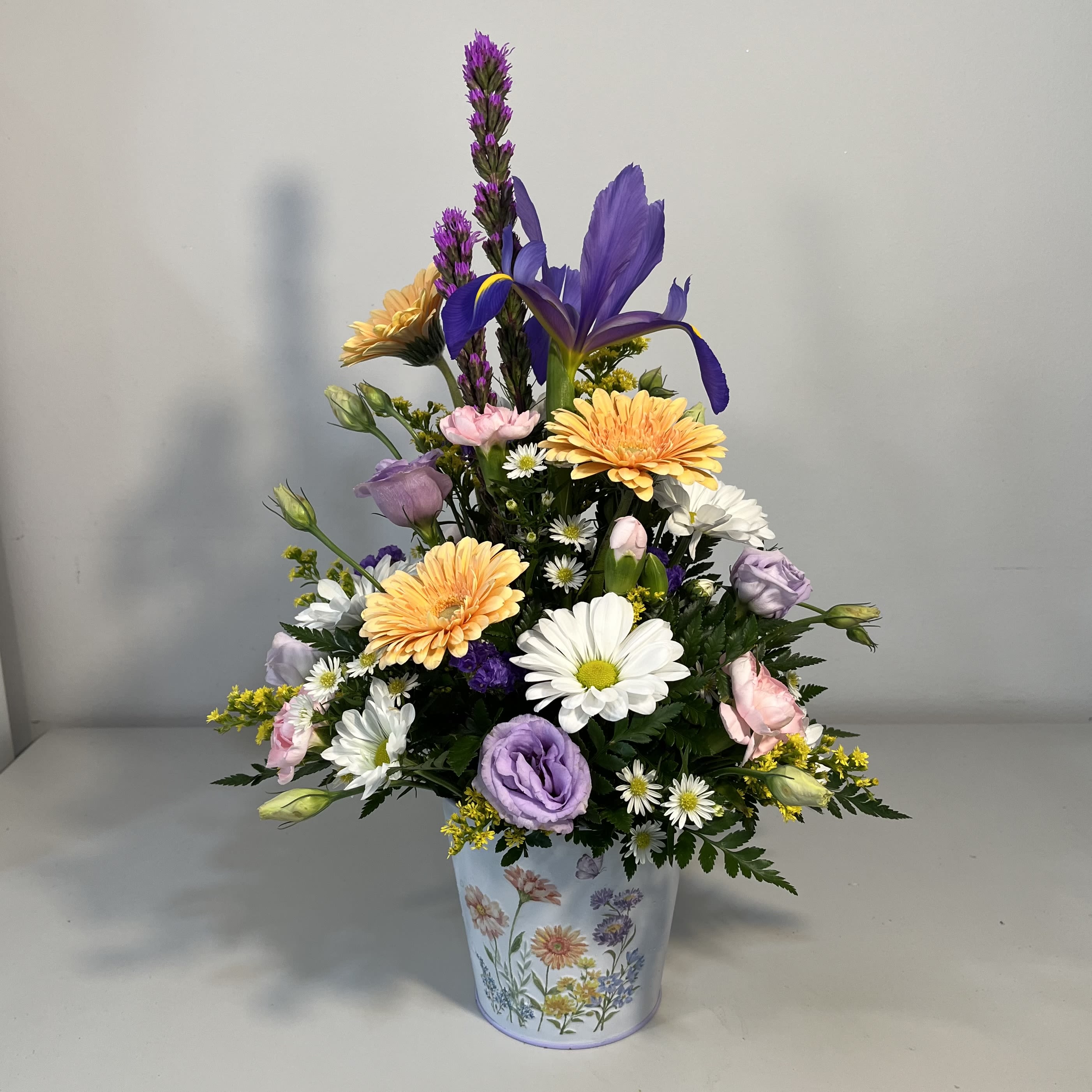 Spring Blossoms - Spring Tin Container filled with Gerbera Daisy, Purple Liatris, Iris, Lizianthus and Daisies