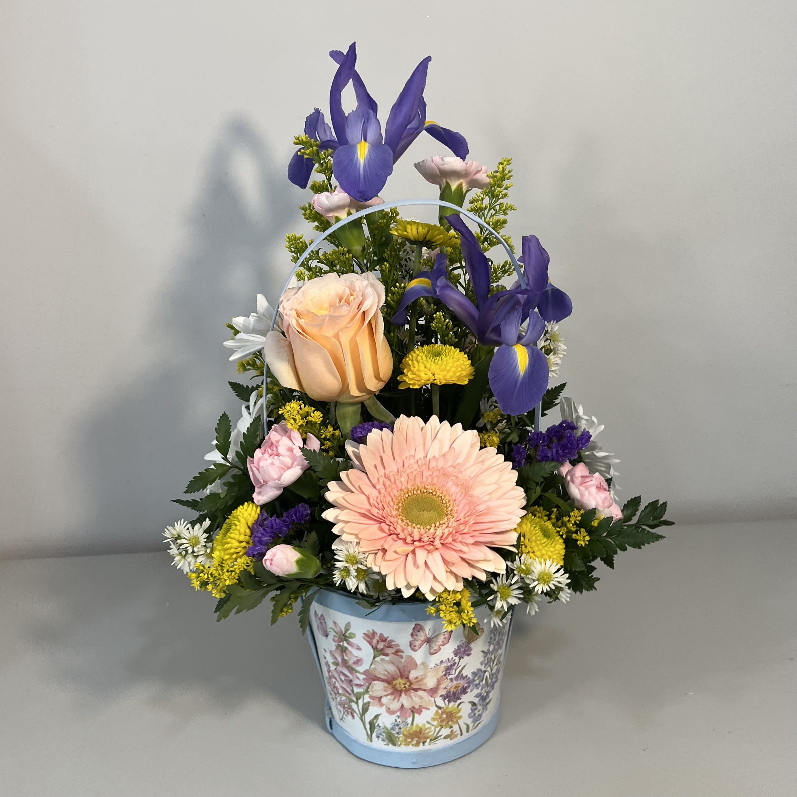Basket of Blooms - Spring basket filled with mixed flowers ( product may differ due to availability)