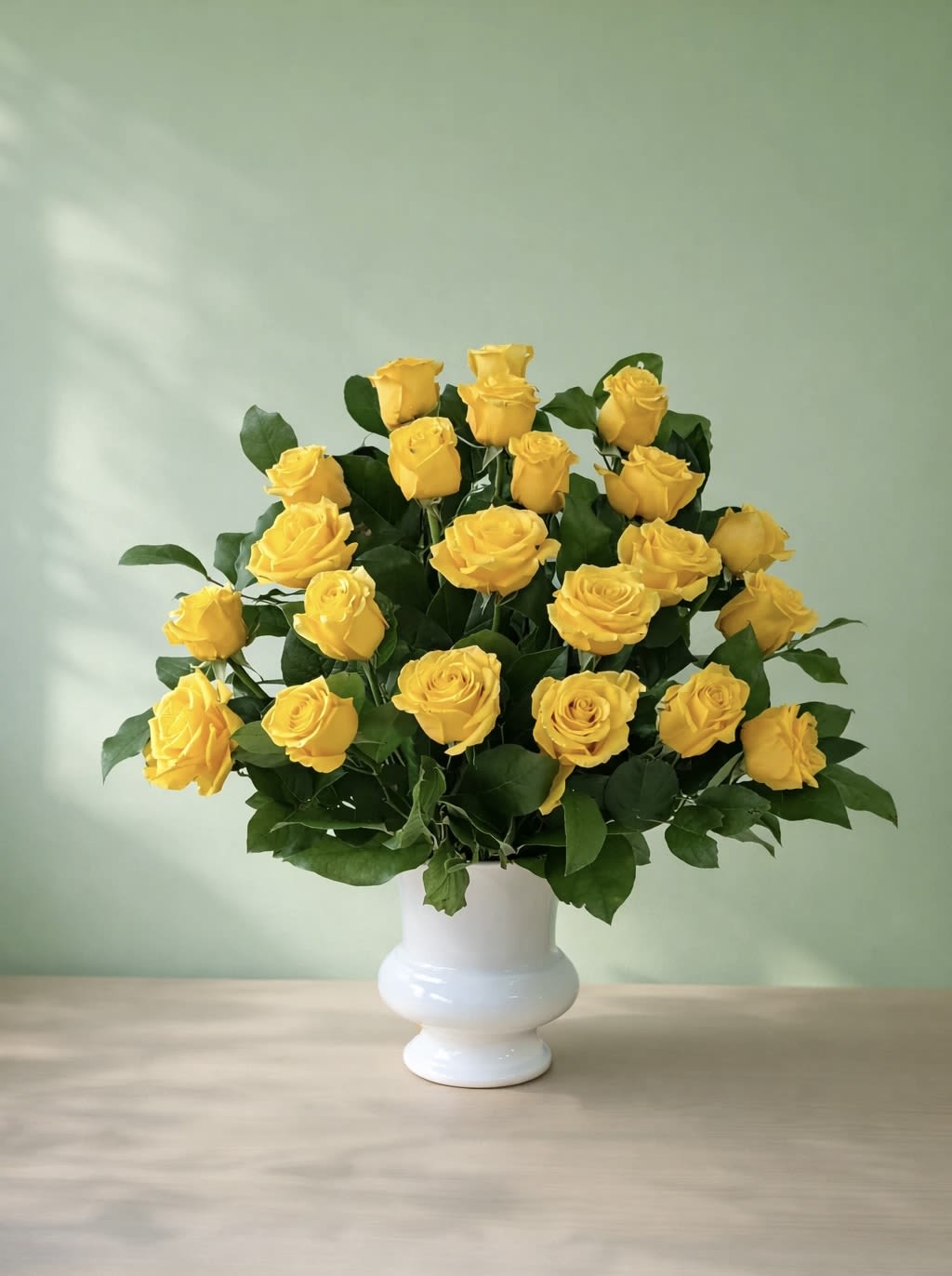 Amber Gold - An exquisite display of premium golden yellow roses, artfully arranged in a urn.