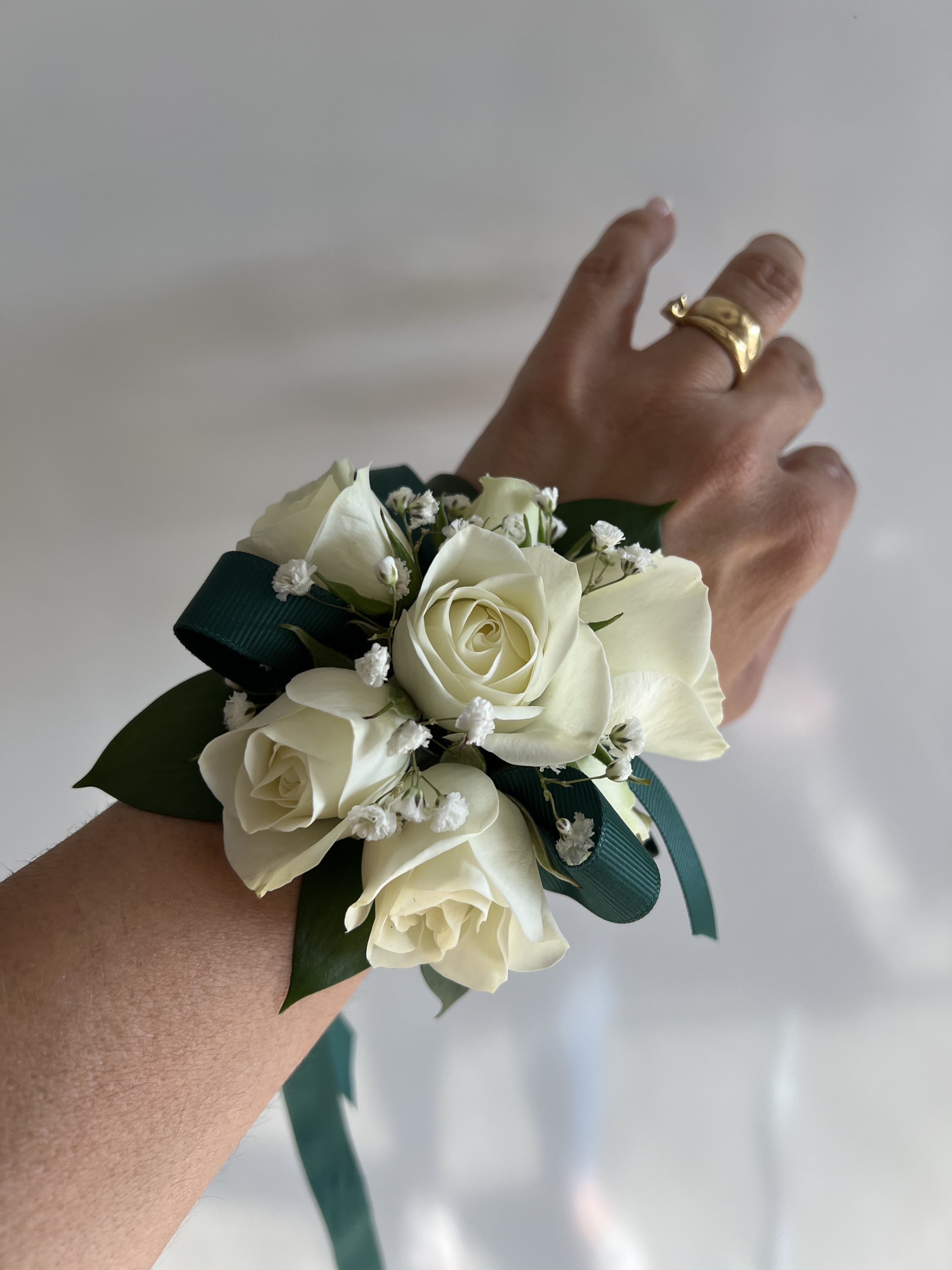 Grace on the Wrist - Soft florals and satin wrap for a corsage that feels like a gentle hug.
