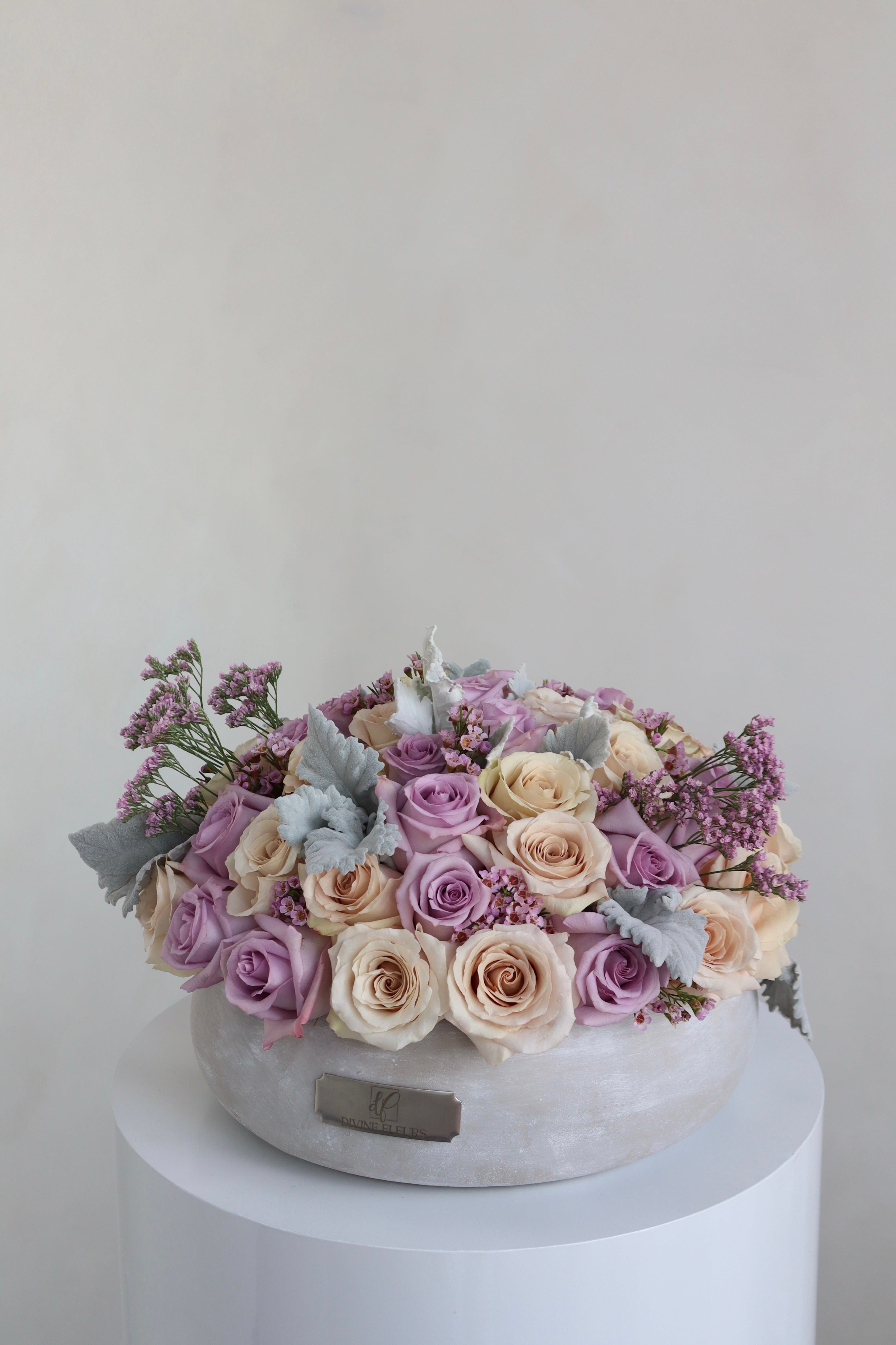 Giselle - Elegant floral arrangement in a luxurious vase, designed with fresh roses, delicate accents, and soft greenery. A timeless gift perfect for celebrating any special occasion. 