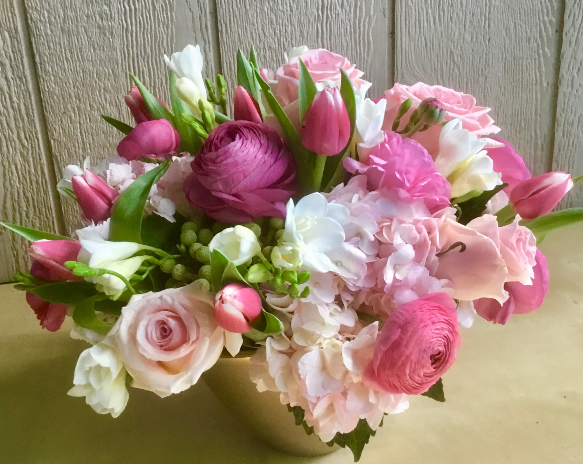 Pink and white mixed bouquet with roses, tulips, and hydrangea