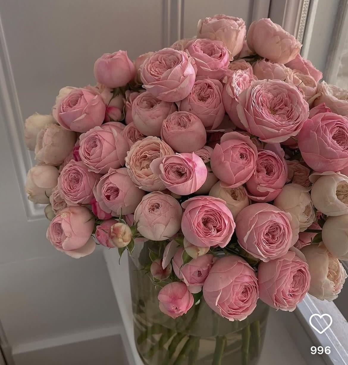 Bouquet of pink ranunculus in a clear glass vase