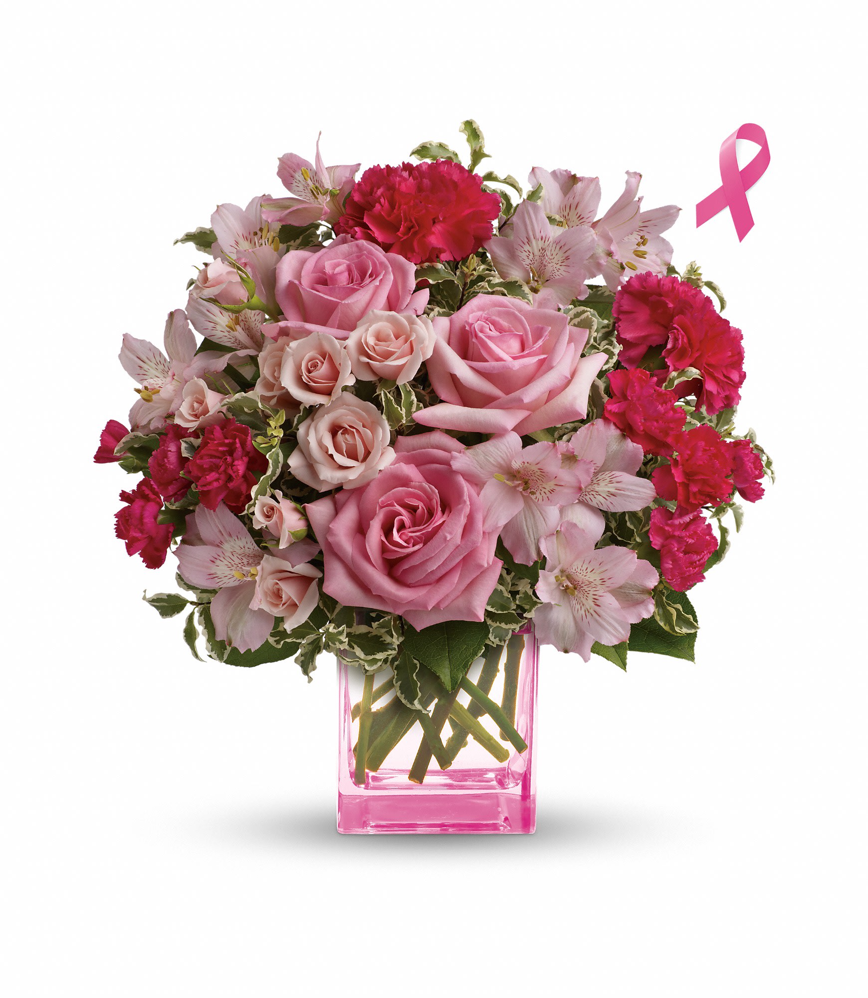 Pink roses and carnations in a pink glass vase with a ribbon