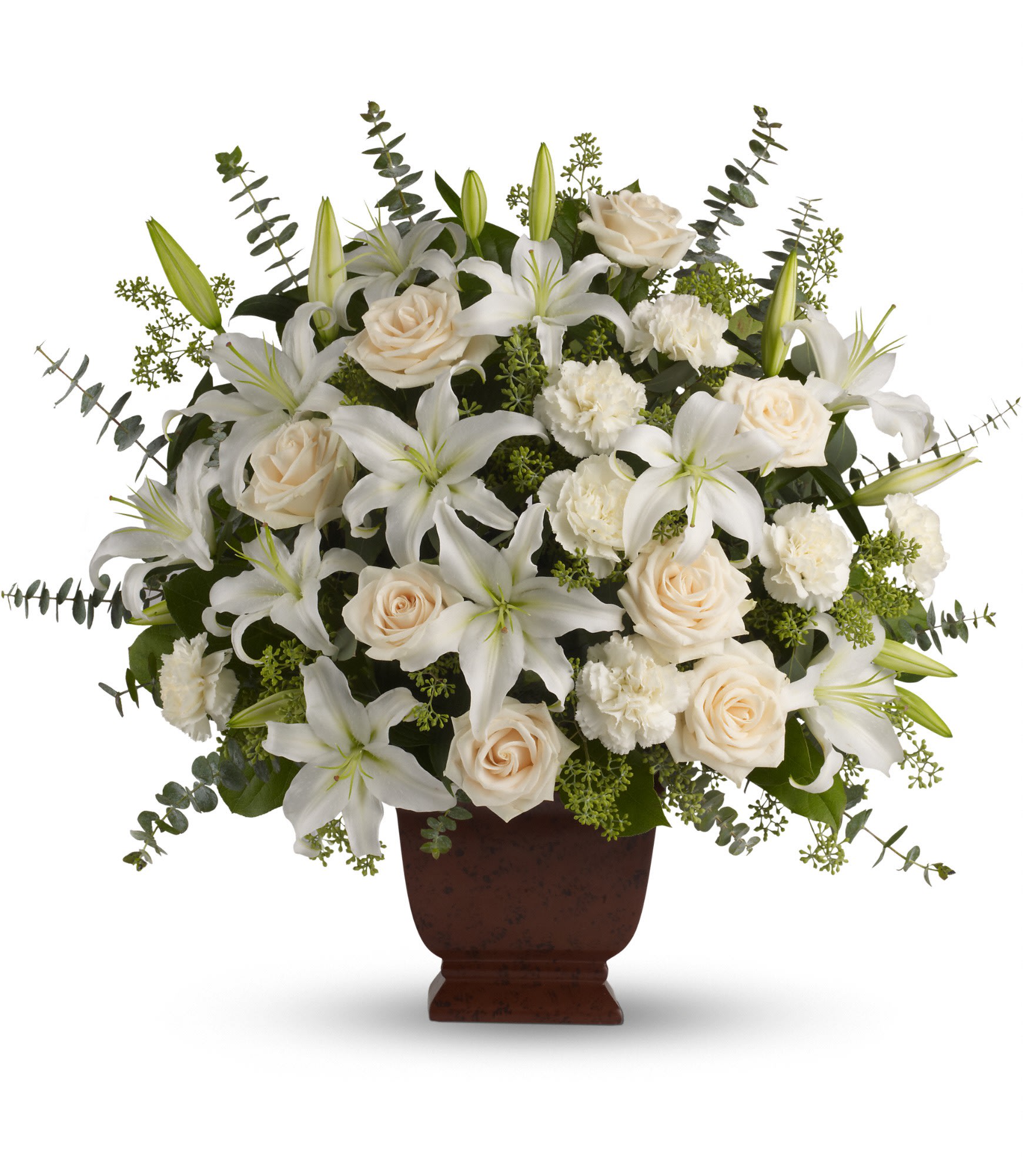 White lilies and cream roses arranged in a brown urn vase