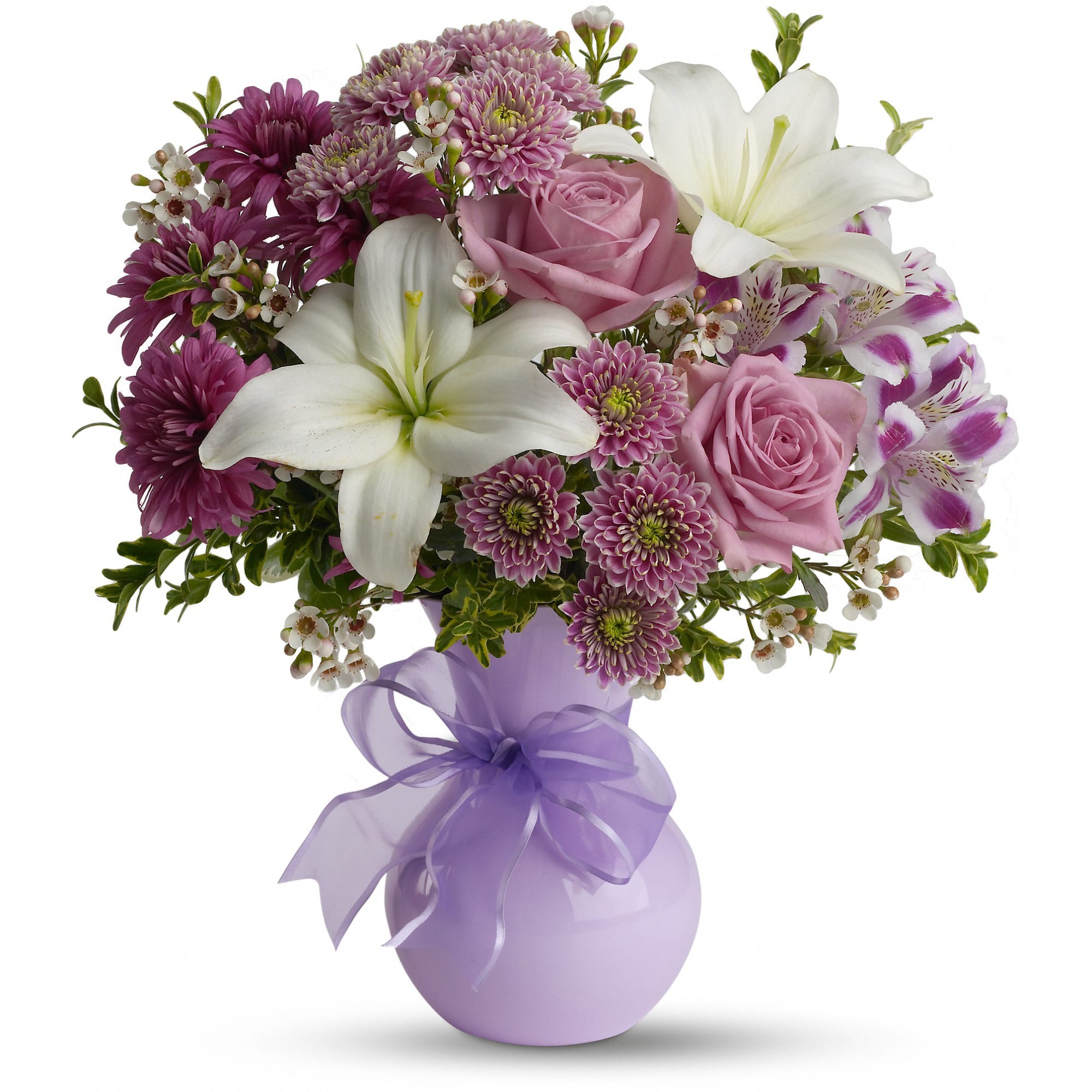 Pink and white mixed flower bouquet in a lavender vase with a ribbon