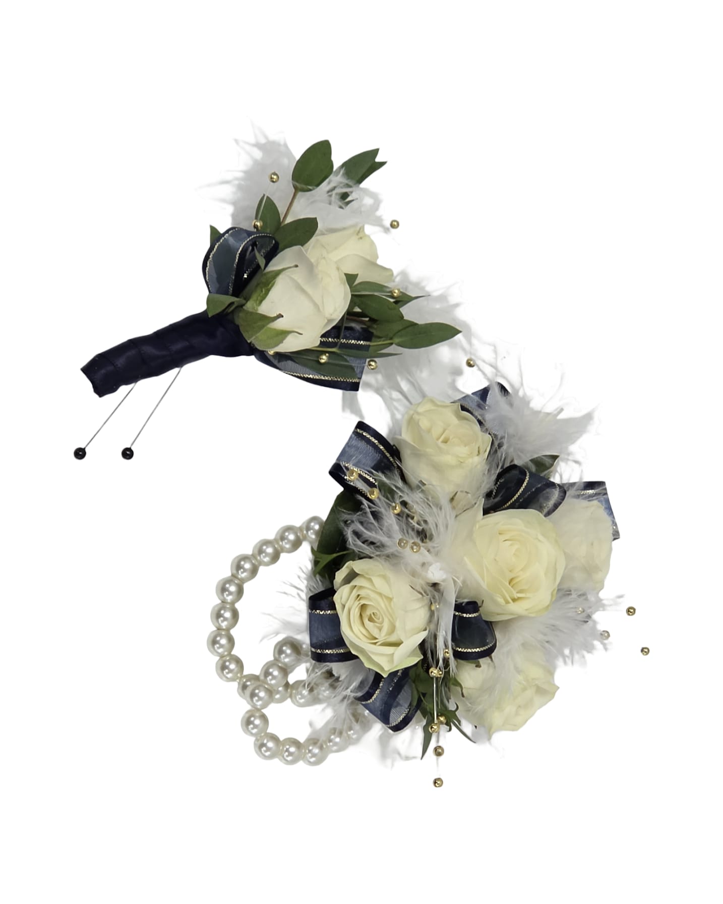 The Royal Evening Set - Creamy white spray roses and velvety navy ribbon give this wristlet corsage and matching boutonniere a formal, romantic look perfect for prom or any black-tie occasion. The coordinated set-compact rounded wristlet and a smaller boutonniere-feels timeless and refined, the kind of accessory that makes the person you're celebrating feel truly seen.  Each piece is finished with airy white feathers, loops of pearl beads, and decorative gold beads for luminous detail; the wristlet fastens on a pearl band for a fancy, comfortable fit.