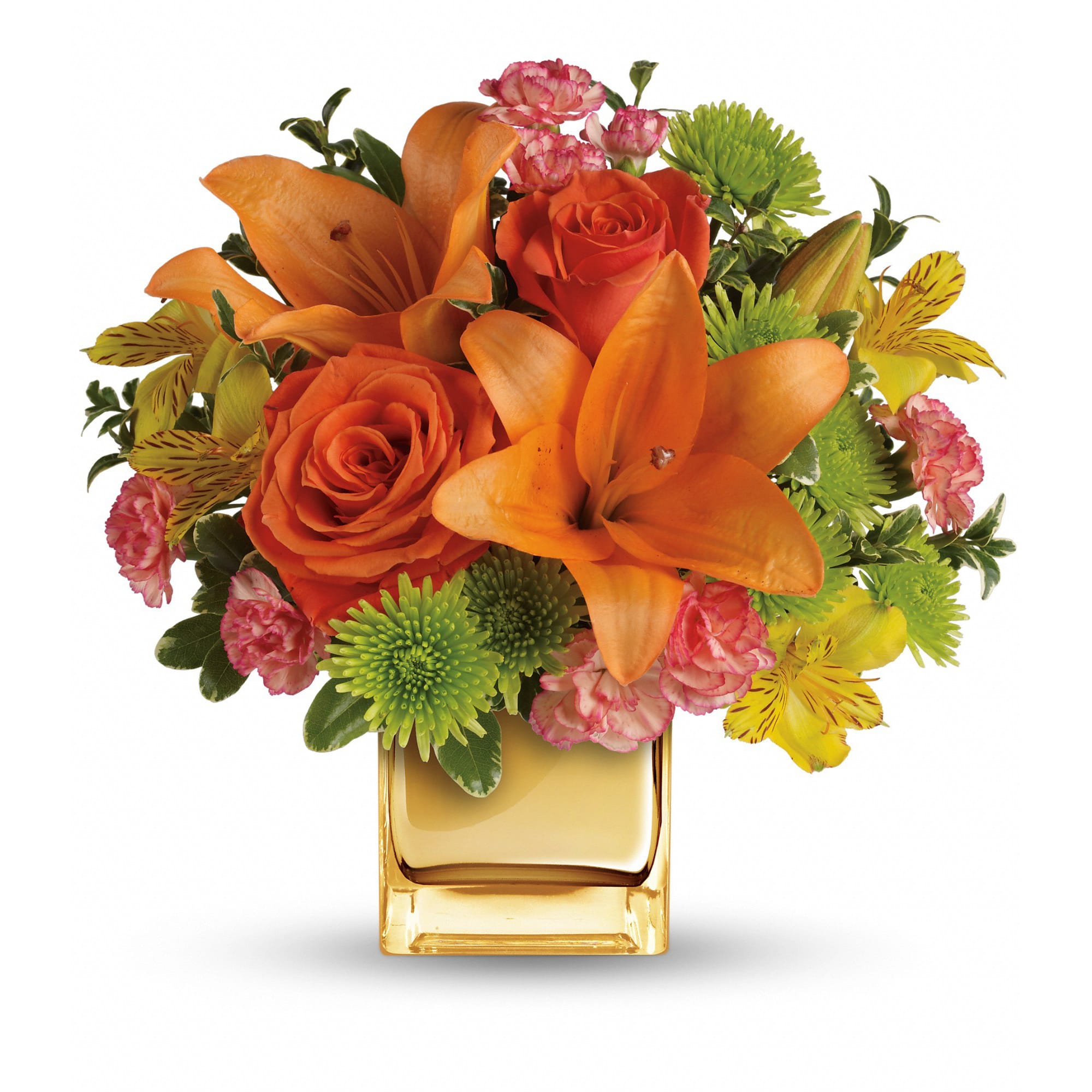 Orange lilies and roses in a square amber vase with pink and green accents