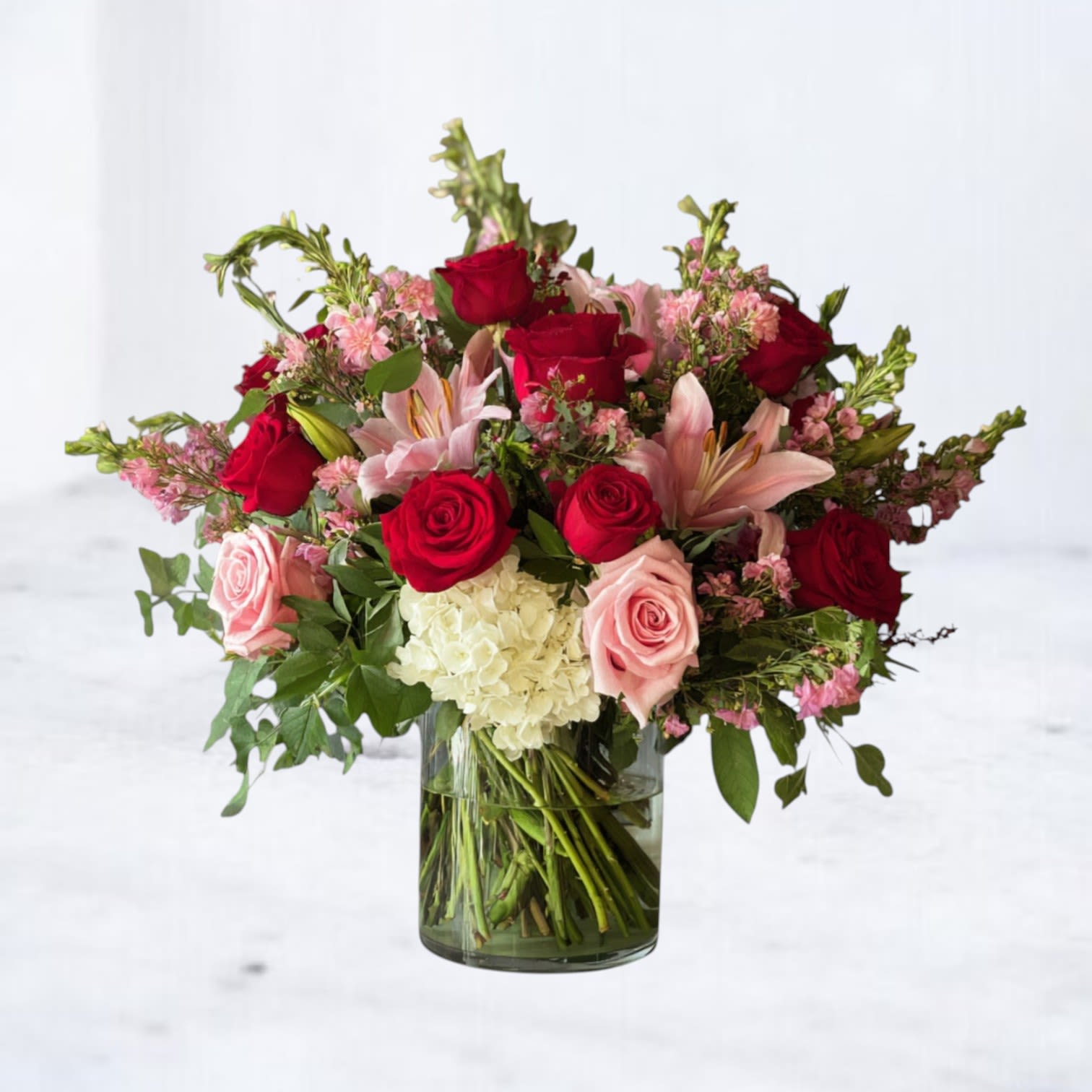Full Bloom - Full Bloom is a bold, garden-forward arrangement designed at peak expression. Lush roses, lilies, and seasonal blooms are layered with fresh greenery for a look that feels vibrant, intentional, and unmistakably alive. Designed with movement and fullness in mind, this arrangement makes an immediate statement—perfect for celebrating, marking a moment, or simply sending something unforgettable.  Whiskey Wallflower is a design-forward florist serving Magnolia, The Woodlands, Montgomery, Willis, Conroe, Spring, Tomball and surrounding Houston-area communities. We specialize in thoughtfully composed, modern floral arrangements with a focus on premium blooms, intentional design, and reliable same-day delivery. Every piece is created with care to make life’s moments feel elevated, personal, and unforgettable.