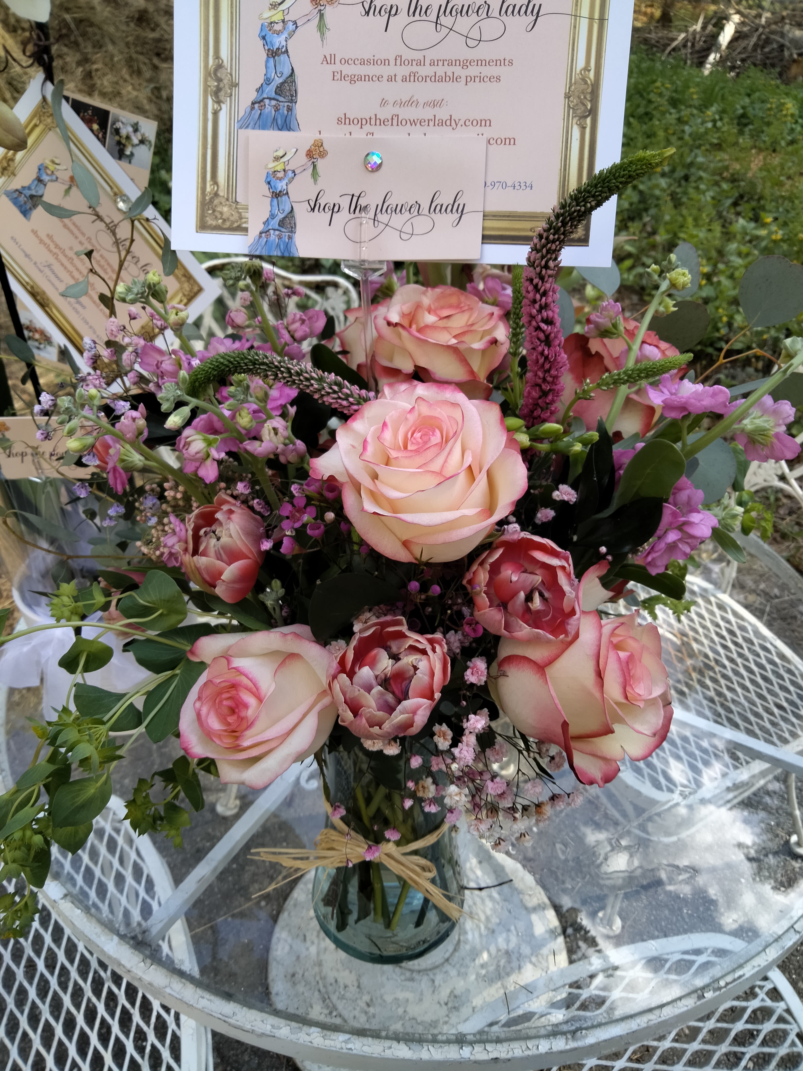 Joie de vivre - This delicate creation is full of girl power.  I used dual colored tea roses, parrot tulips, ranunculas, wax flower, scent filled stock, and verbena to create an arrangement that fits any occasion.